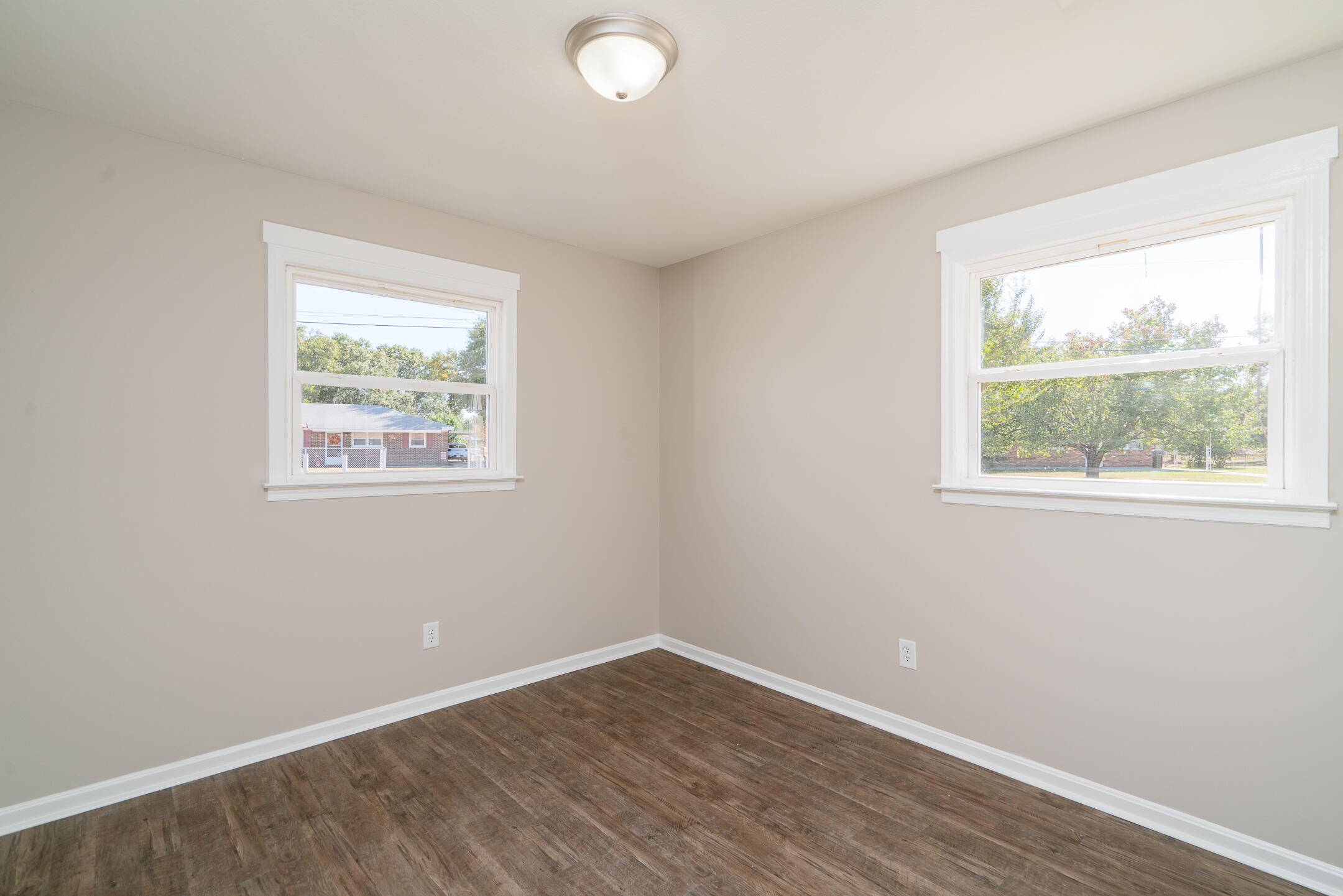3219 Ronda Drive Augusta, GA 30906 - Photo 22 of 26 a view of an empty room with wooden floor and a window