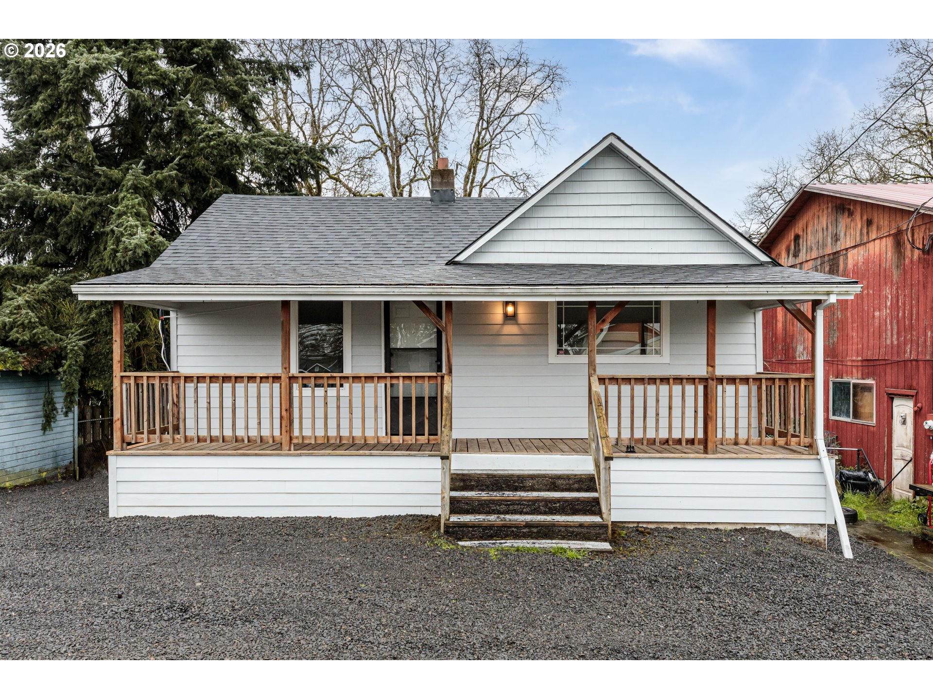 415 North 9th Street St. Helens, OR 97051 - Photo 1 of 21 a view of a house with a small yard and wooden fence