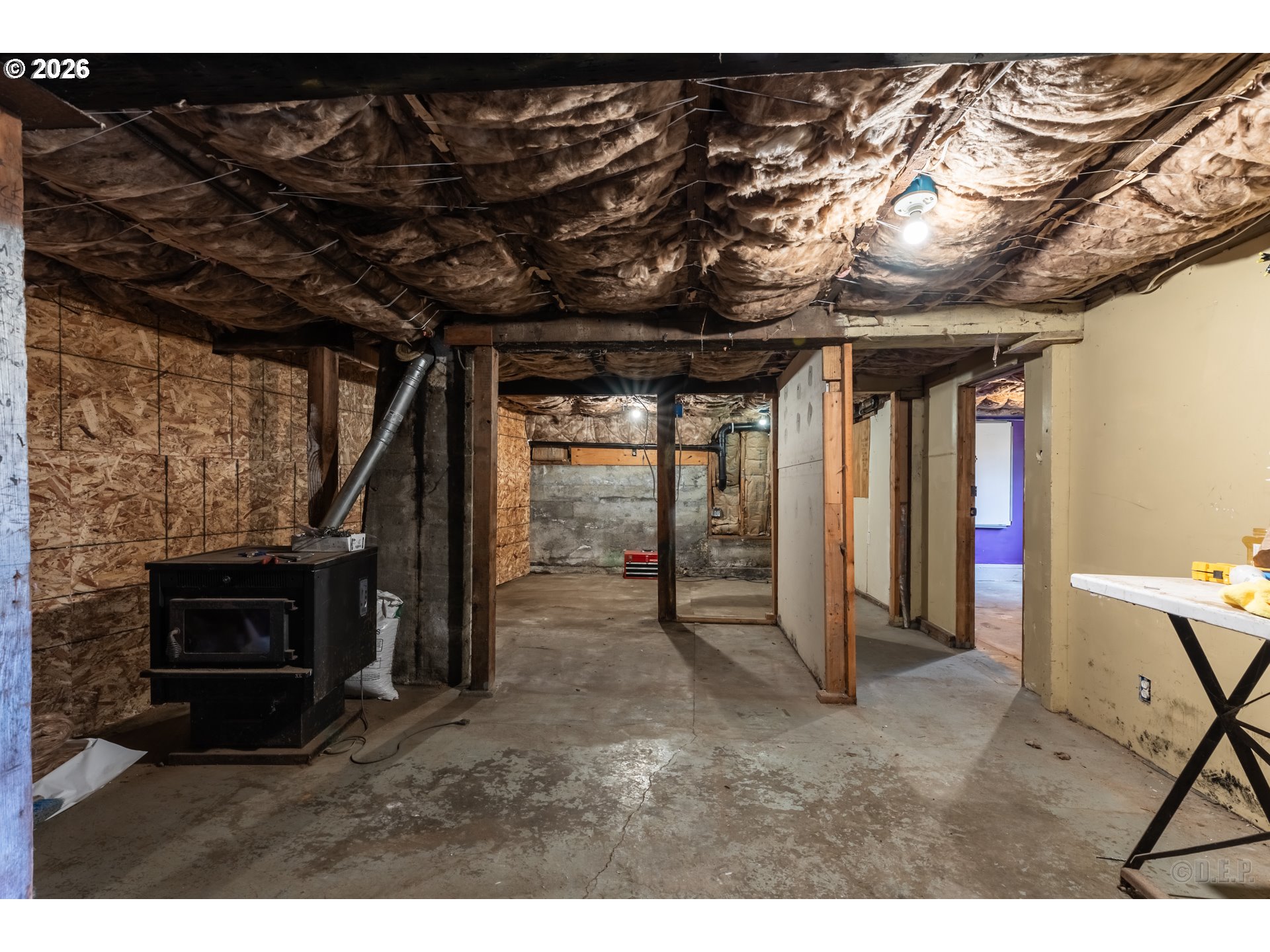 415 North 9th Street St. Helens, OR 97051 - Photo 15 of 21 a view of an empty room with furniture and a fireplace