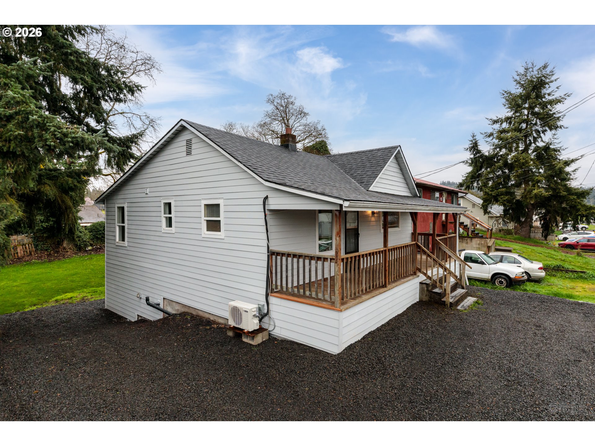 415 North 9th Street St. Helens, OR 97051 - Photo 2 of 21 a view of a house with a small yard and wooden fence