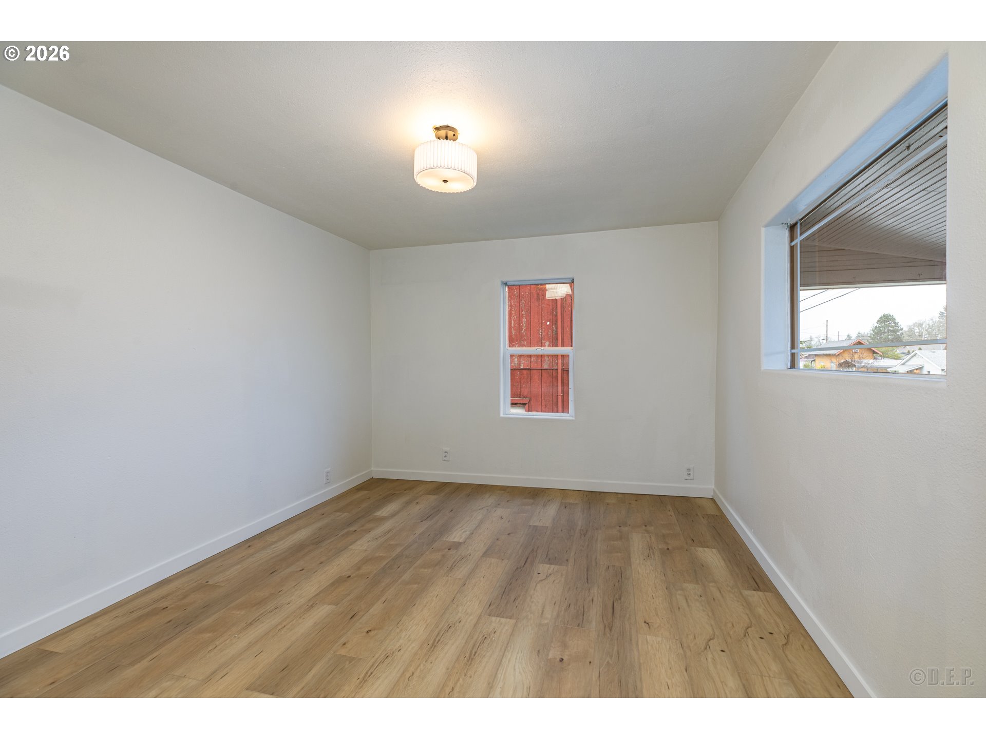 415 North 9th Street St. Helens, OR 97051 - Photo 4 of 21 a view of an empty room with a window