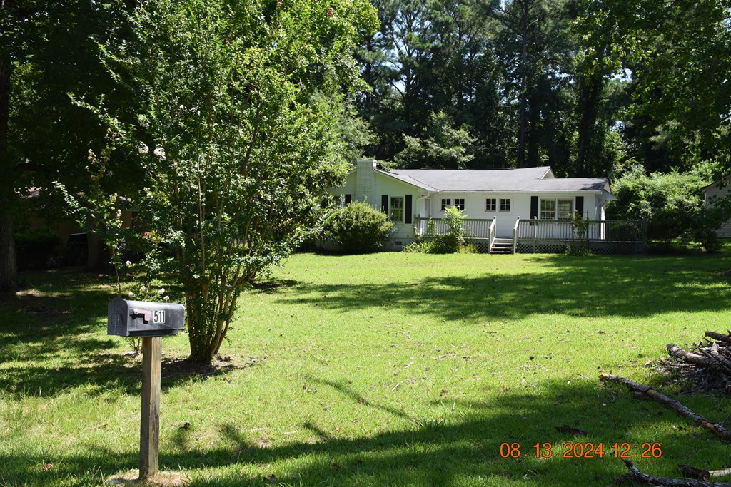 511 Chafin Drive Manchester, GA 31816 - Photo 11 of 16 a front view of a house with yard and green space