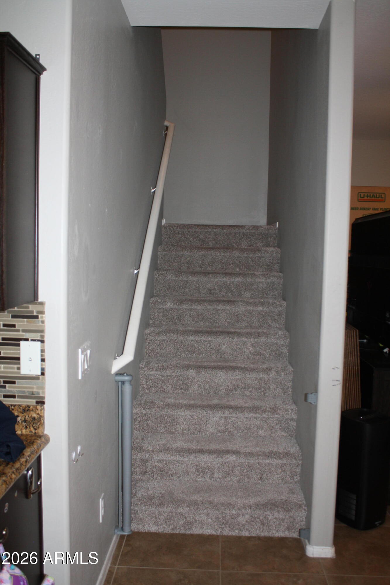 10225 West Camelback Road, Unit 19 Phoenix, AZ 85037 - Photo 21 of 51 a view of staircase with white walls and a window