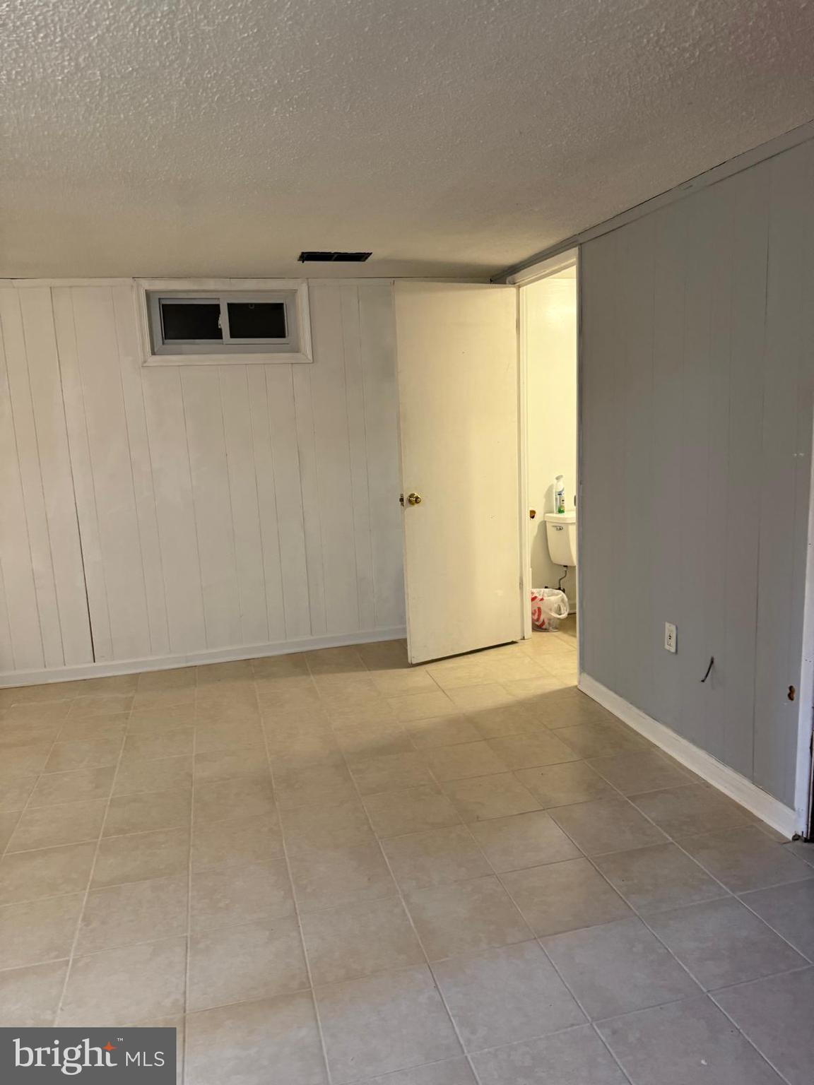 229 Old Line Avenue Laurel, MD 20724 - Photo 22 of 42 a view of an empty room with a window
