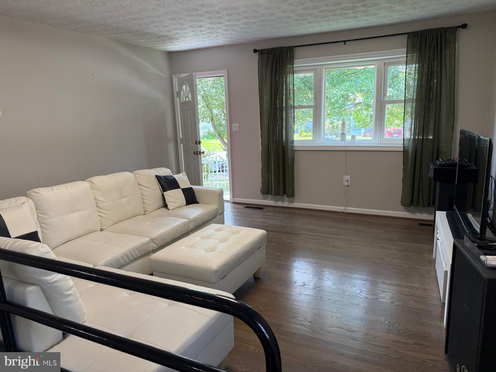 229 Old Line Avenue Laurel, MD 20724 - Photo 3 of 42 a living room with furniture and a flat screen tv