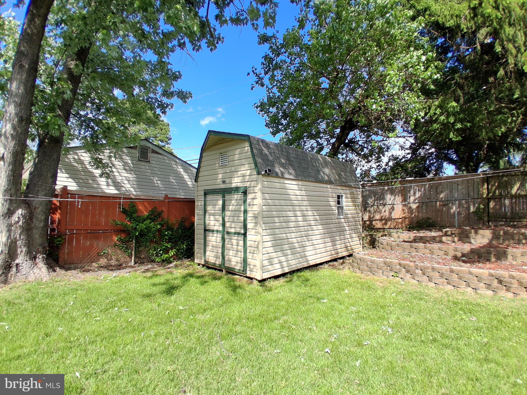 229 Old Line Avenue Laurel, MD 20724 - Photo 35 of 42 a front view of a house with a yard garage and tree