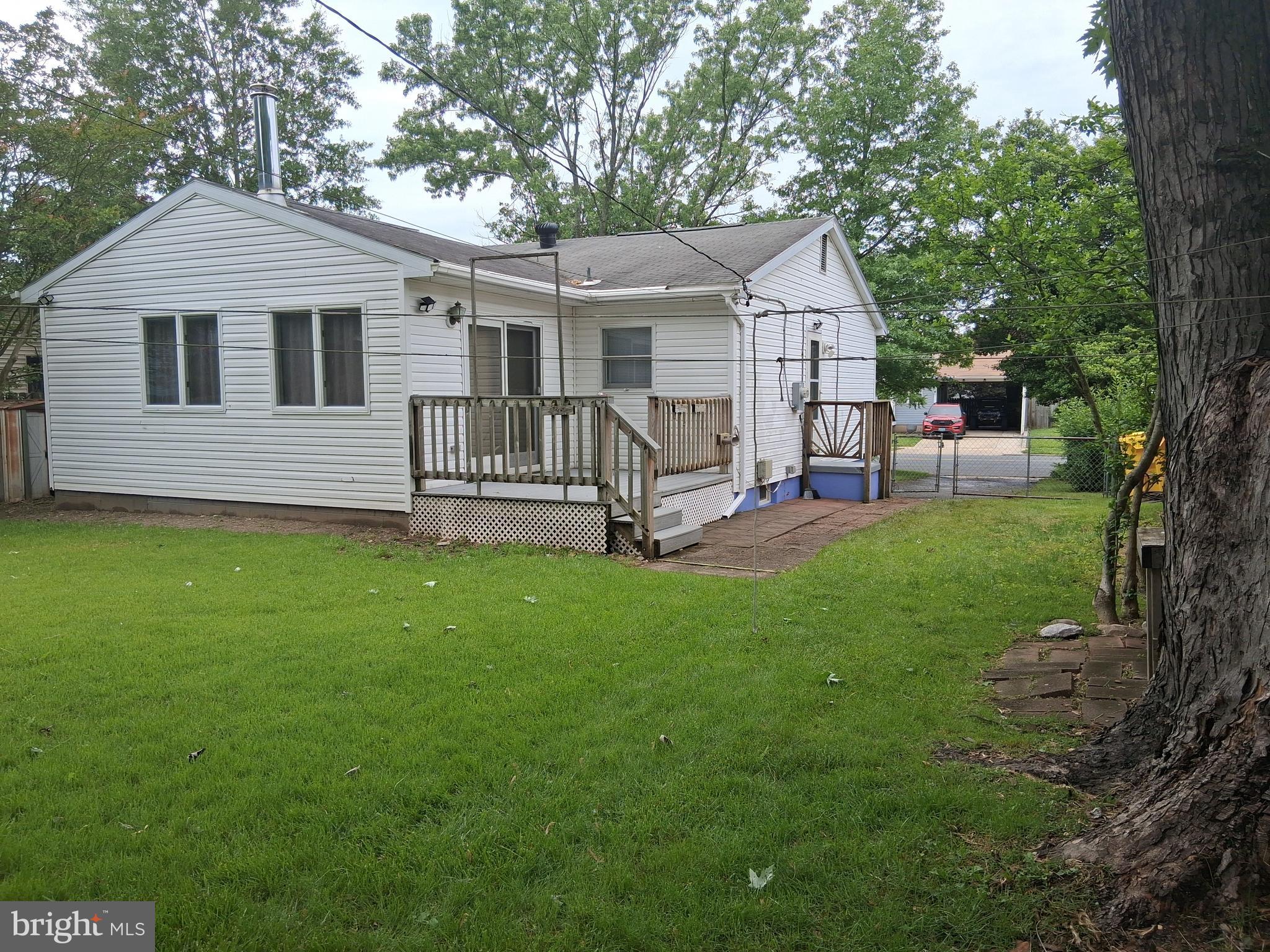 229 Old Line Avenue Laurel, MD 20724 - Photo 40 of 42 a view of a house with a yard and a garden