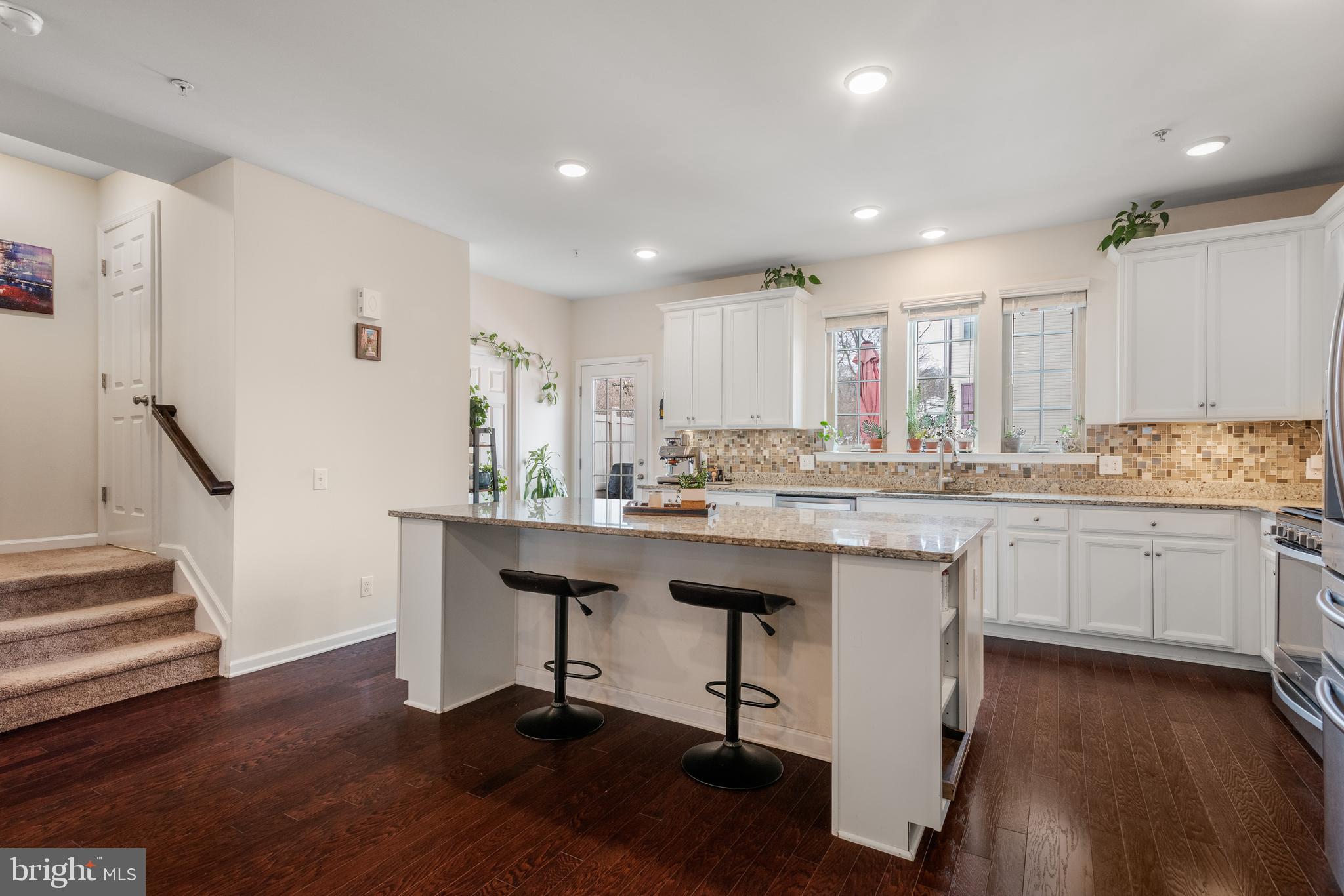 35 Addison Lane Malvern, PA 19355 - Photo 11 of 42 a kitchen with counter top space a sink appliances and cabinets
