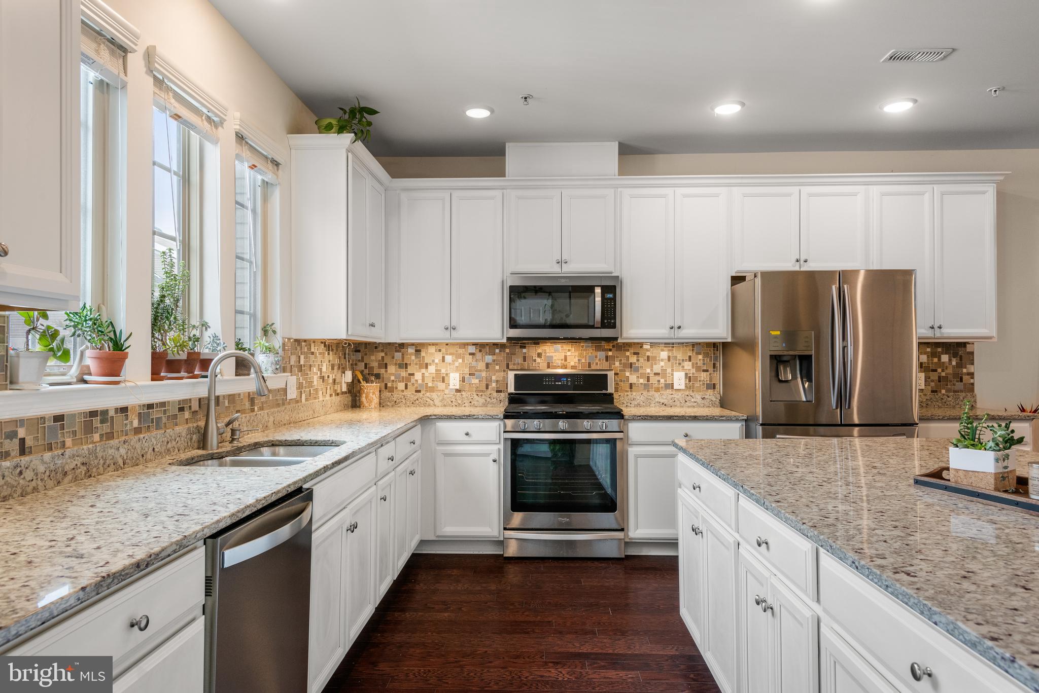 35 Addison Lane Malvern, PA 19355 - Photo 13 of 42 a kitchen with a sink stainless steel appliances and white cabinets