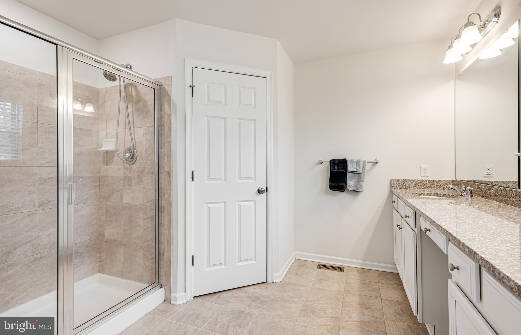 35 Addison Lane Malvern, PA 19355 - Photo 22 of 42 a bathroom with a shower and a sink