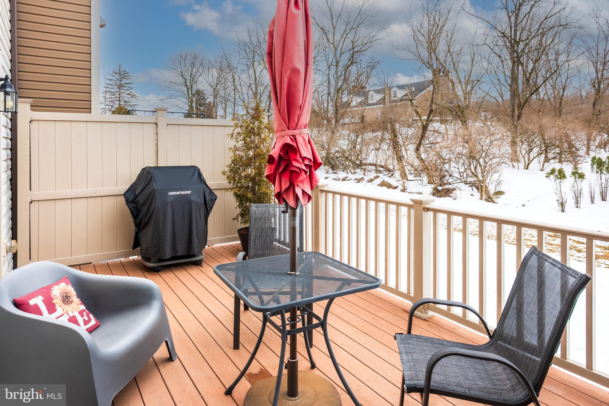 35 Addison Lane Malvern, PA 19355 - Photo 36 of 42 a backyard of a house with table and chairs