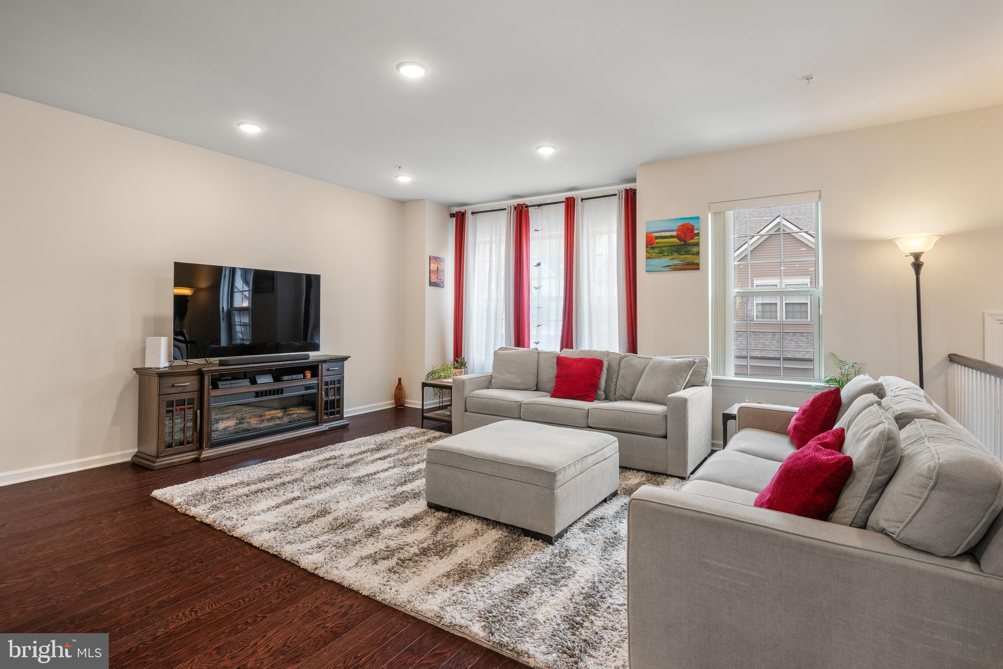 35 Addison Lane Malvern, PA 19355 - Photo 5 of 42 a living room with furniture and a flat screen tv