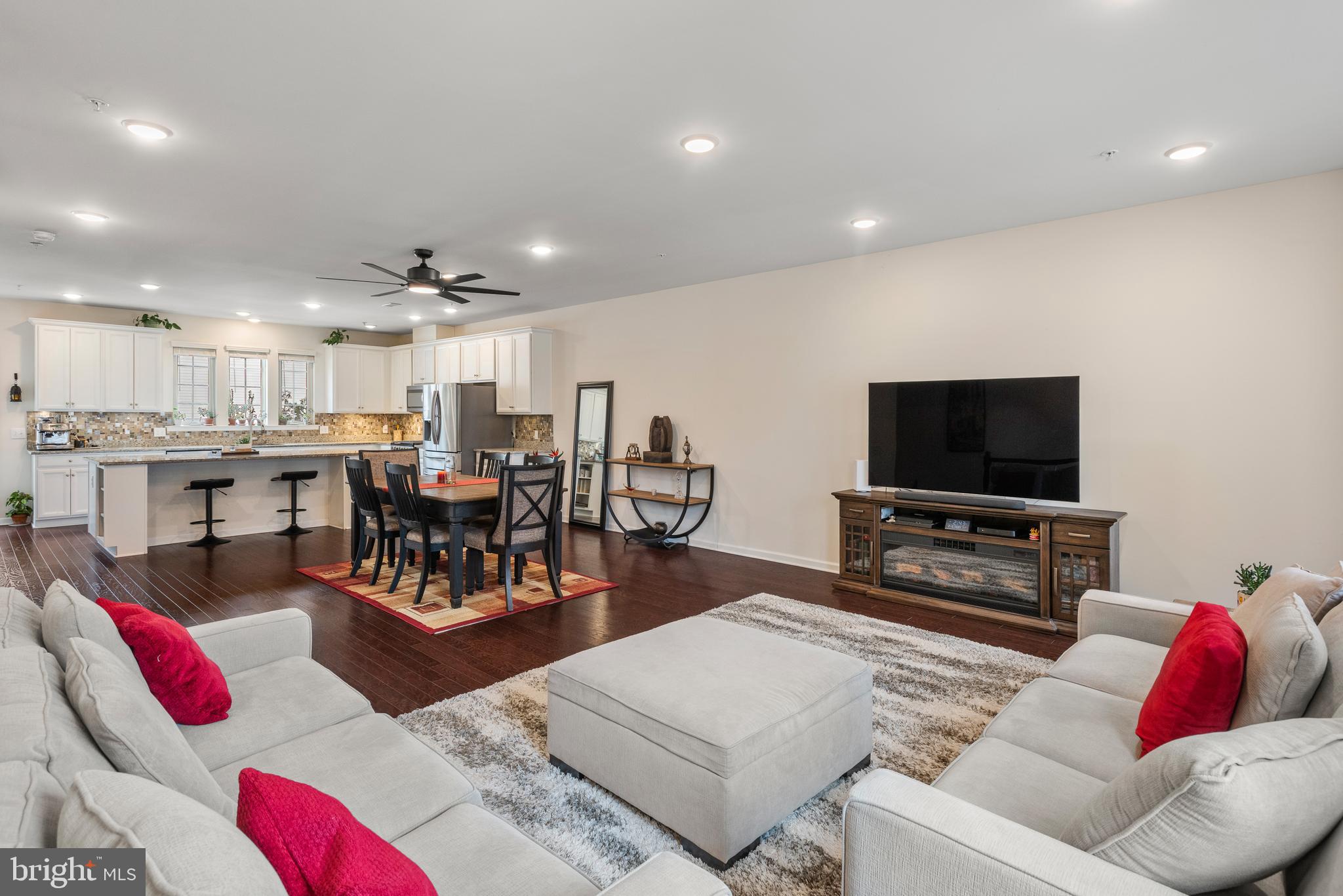 35 Addison Lane Malvern, PA 19355 - Photo 6 of 42 a living room with furniture kitchen view and a flat screen tv