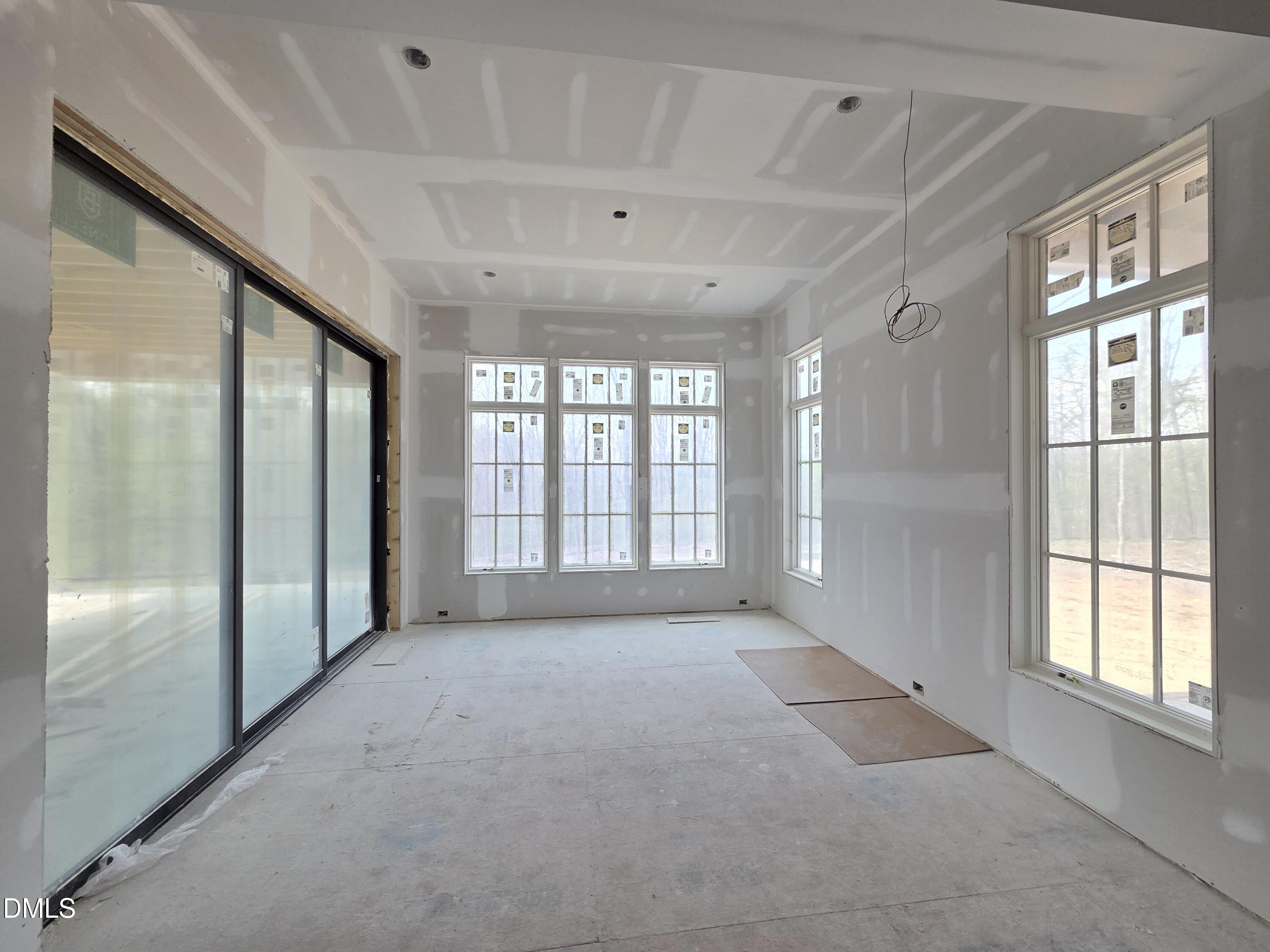6477 Sanctuary Falls Drive Raleigh, NC 27614 - Photo 16 of 49 a view of an empty room with a window