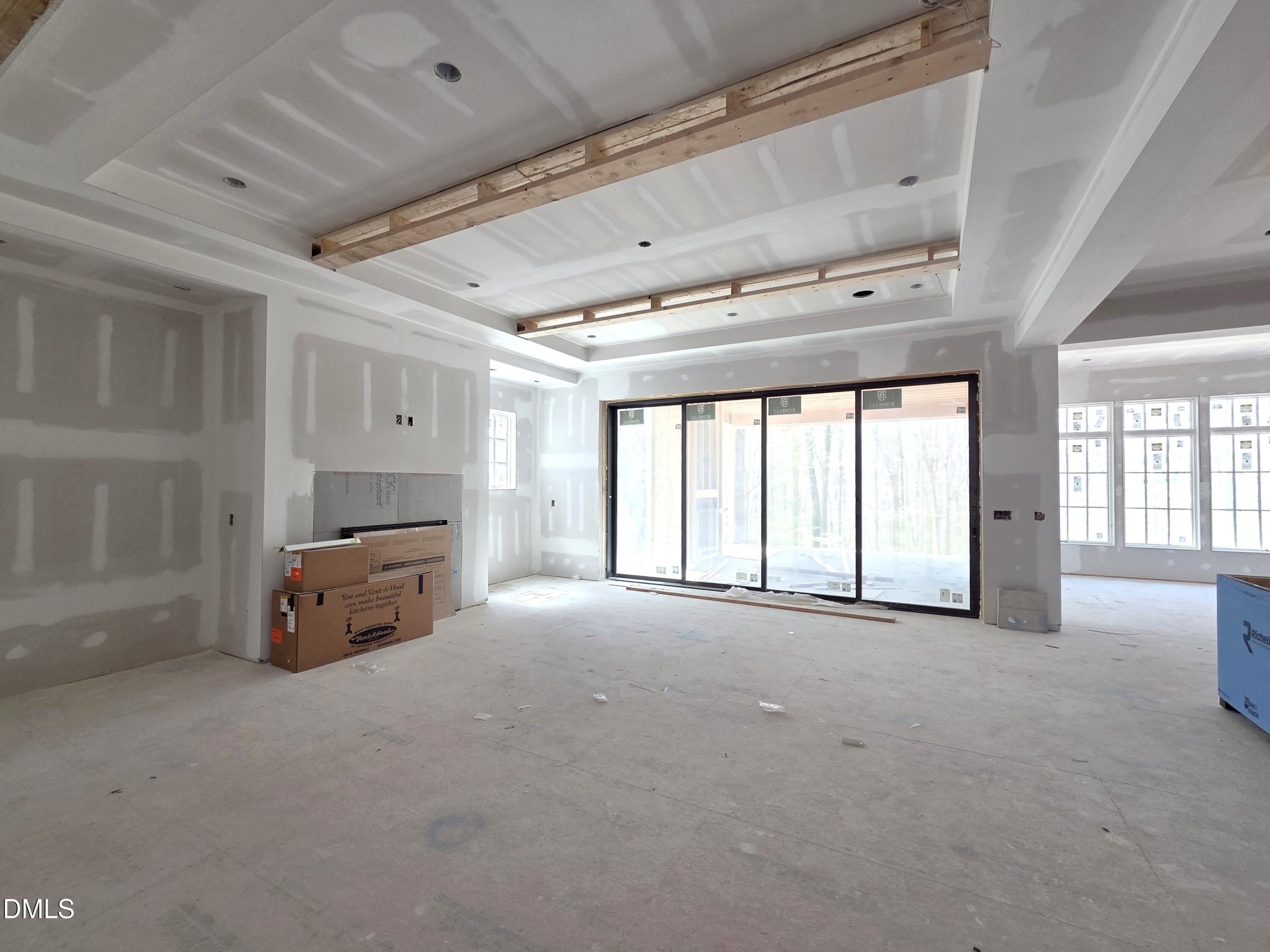 6477 Sanctuary Falls Drive Raleigh, NC 27614 - Photo 19 of 49 a view of an empty room with a window