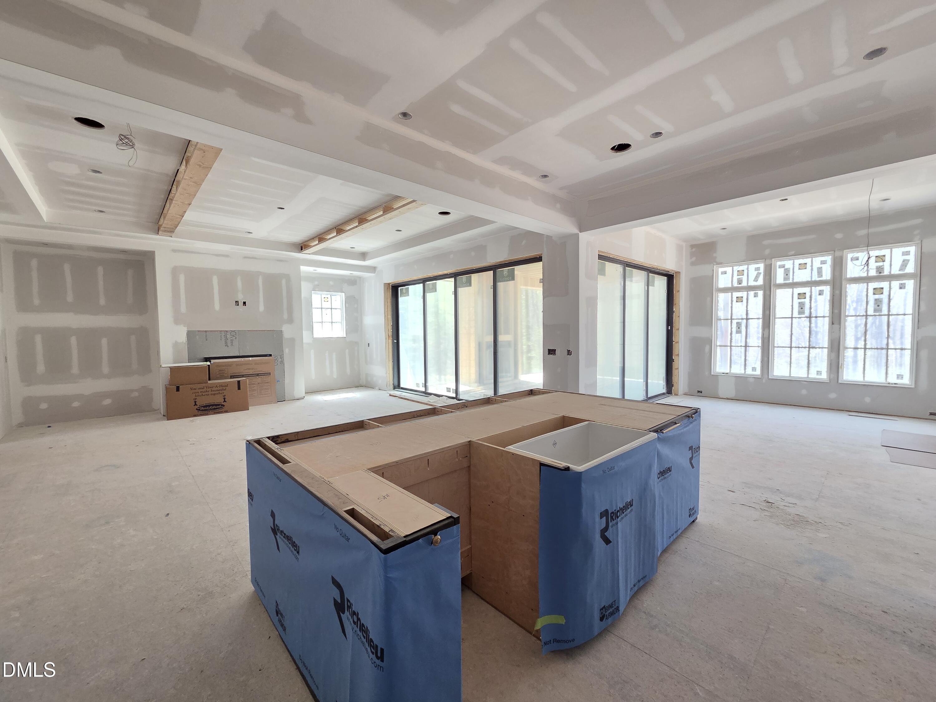 6477 Sanctuary Falls Drive Raleigh, NC 27614 - Photo 21 of 49 a kitchen with a stove a sink dishwasher and a refrigerator with wooden cabinets