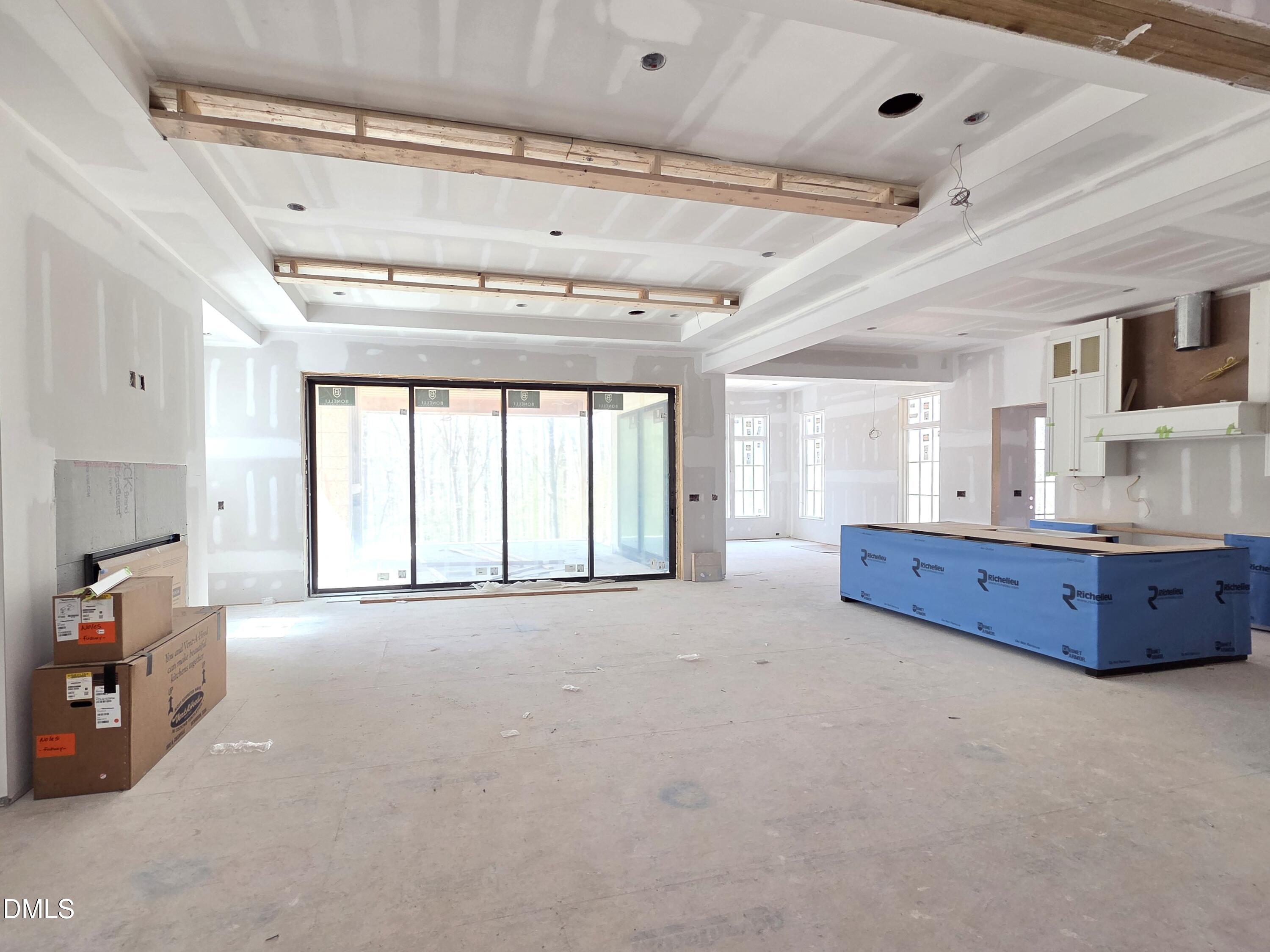 6477 Sanctuary Falls Drive Raleigh, NC 27614 - Photo 23 of 49 a large room with chandelier fan and windows