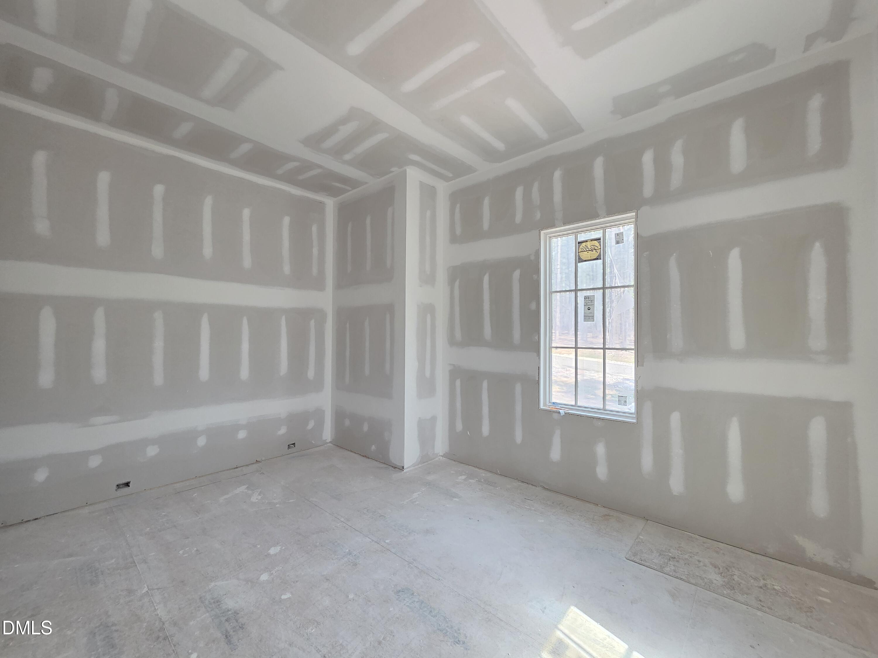 6477 Sanctuary Falls Drive Raleigh, NC 27614 - Photo 25 of 49 a view of an empty room with a window