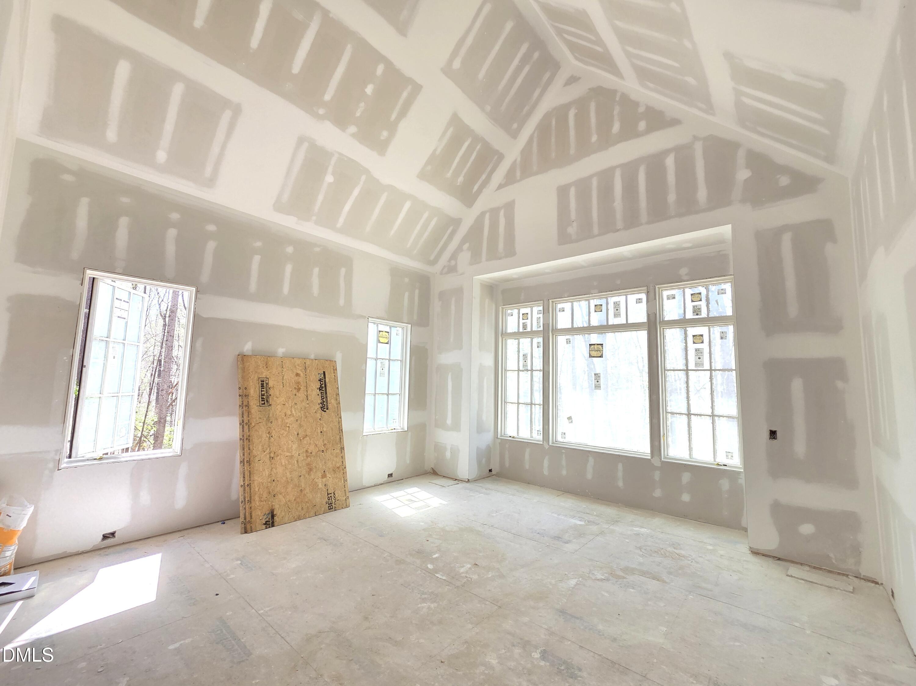 6477 Sanctuary Falls Drive Raleigh, NC 27614 - Photo 27 of 49 an empty room with windows