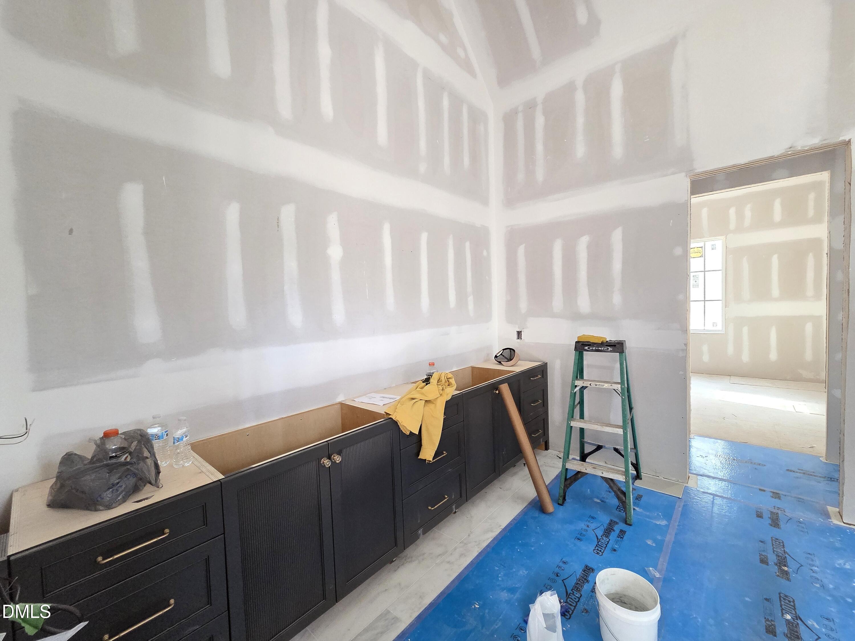 6477 Sanctuary Falls Drive Raleigh, NC 27614 - Photo 28 of 49 a room with furniture and wooden floor