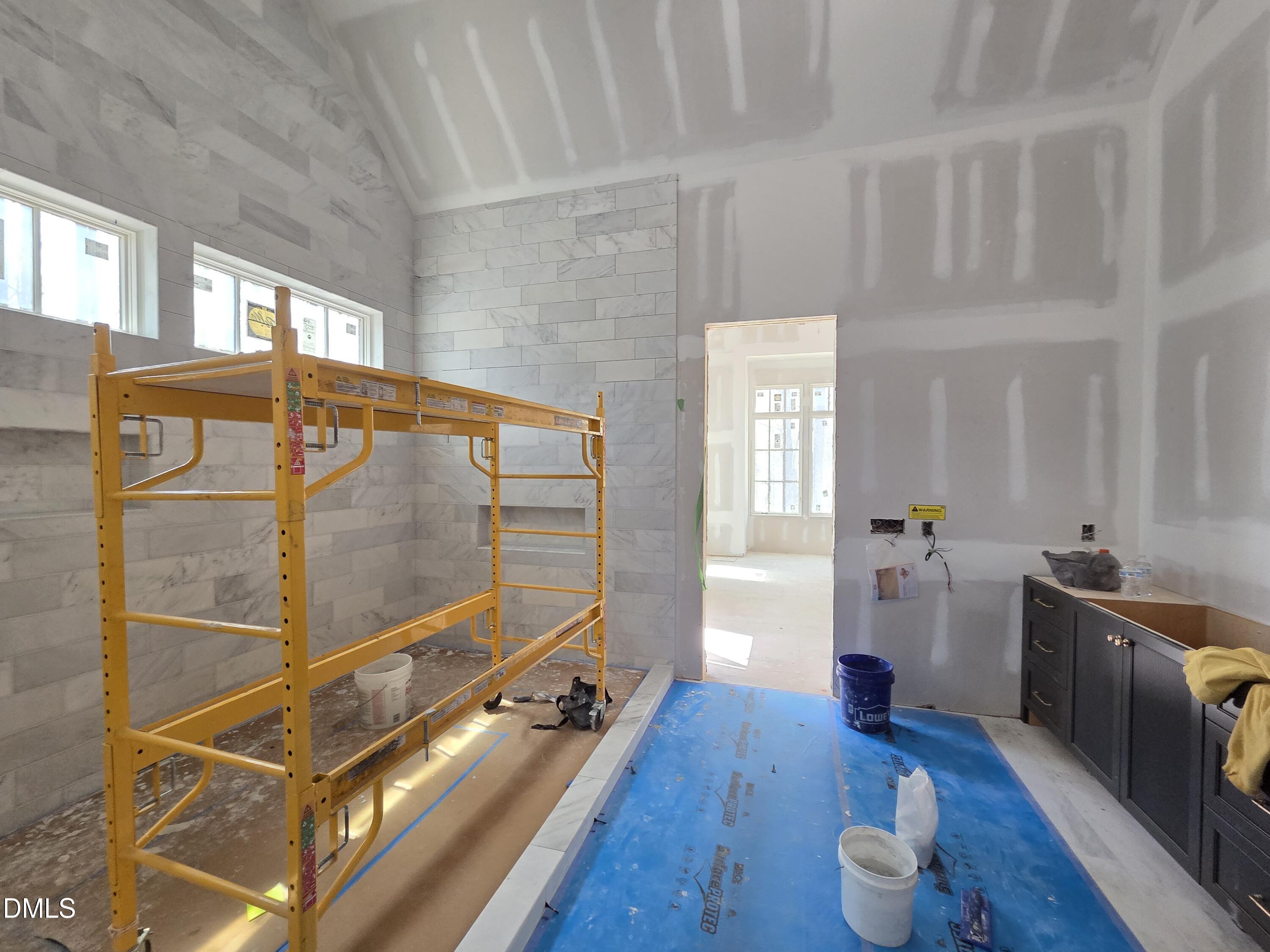 6477 Sanctuary Falls Drive Raleigh, NC 27614 - Photo 30 of 49 a room with furniture and wooden floor
