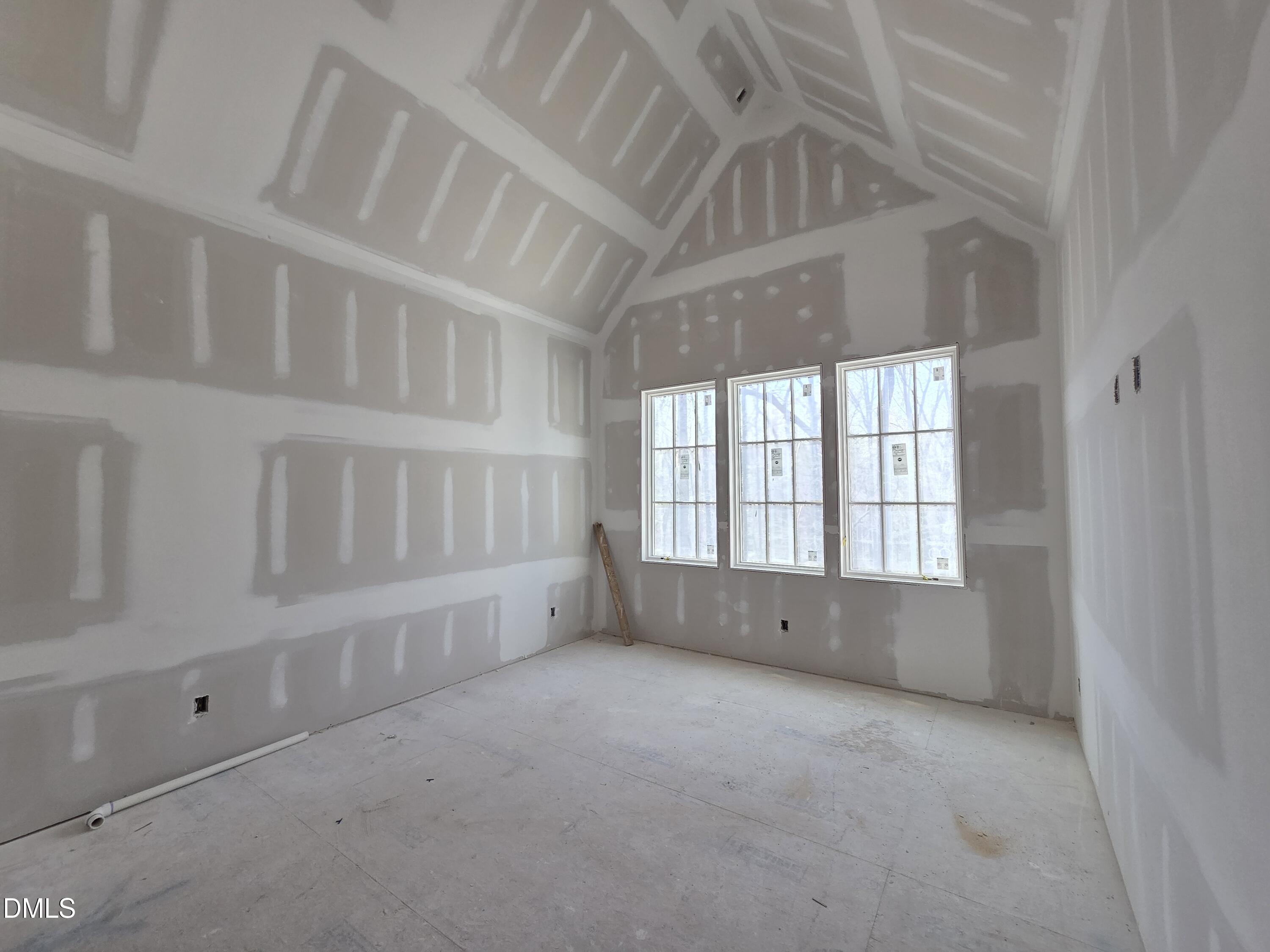 6477 Sanctuary Falls Drive Raleigh, NC 27614 - Photo 33 of 49 an empty room with windows