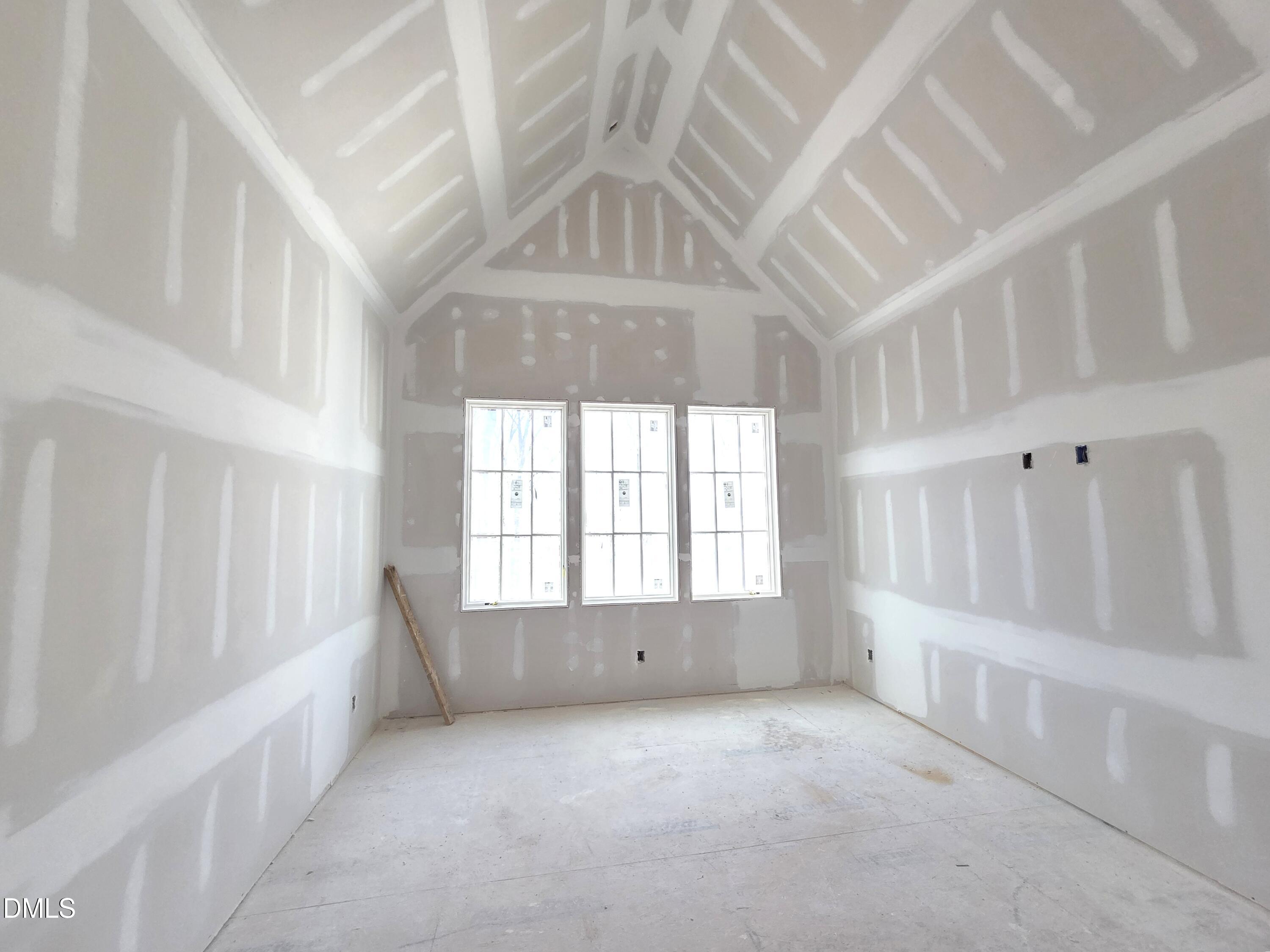 6477 Sanctuary Falls Drive Raleigh, NC 27614 - Photo 35 of 49 an empty room with windows