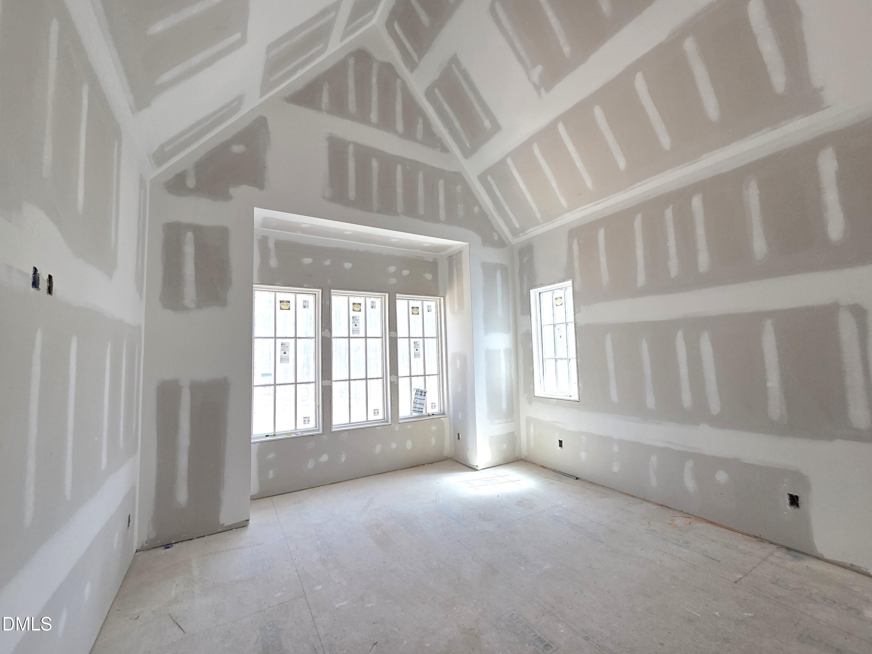 6477 Sanctuary Falls Drive Raleigh, NC 27614 - Photo 36 of 49 a view of an empty room with a window
