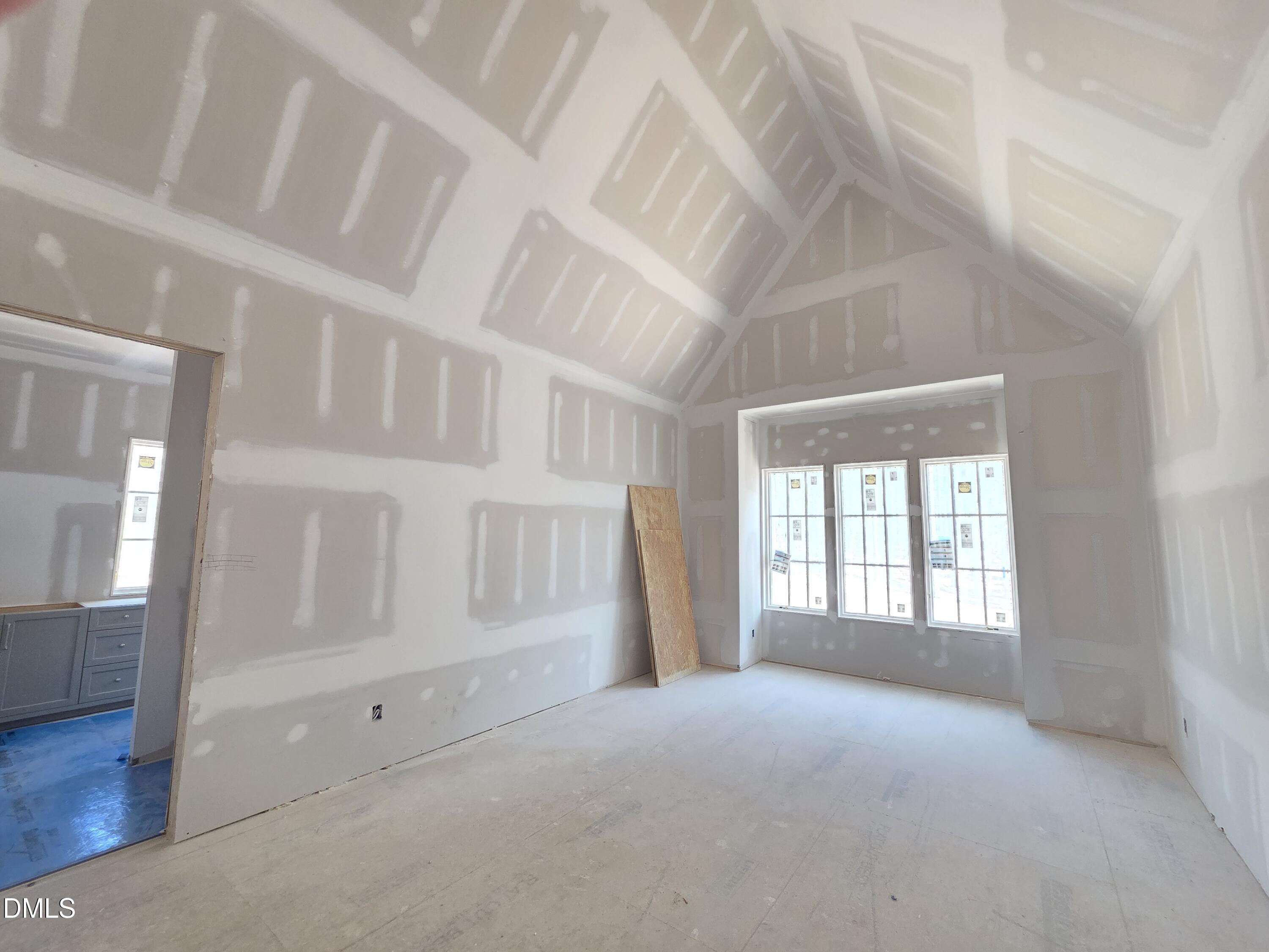 6477 Sanctuary Falls Drive Raleigh, NC 27614 - Photo 38 of 49 an empty room with windows