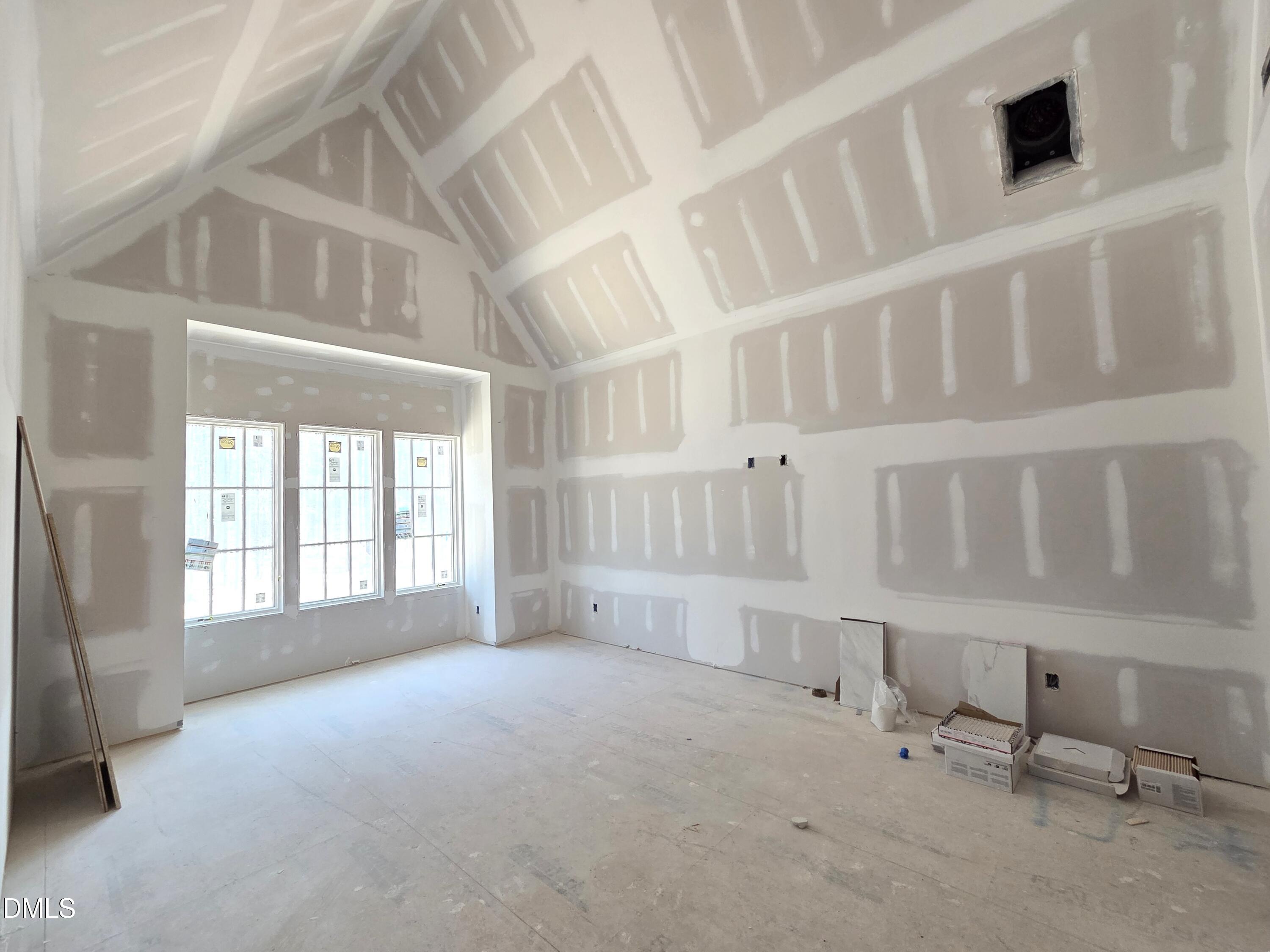 6477 Sanctuary Falls Drive Raleigh, NC 27614 - Photo 40 of 49 a view of an empty room with a window