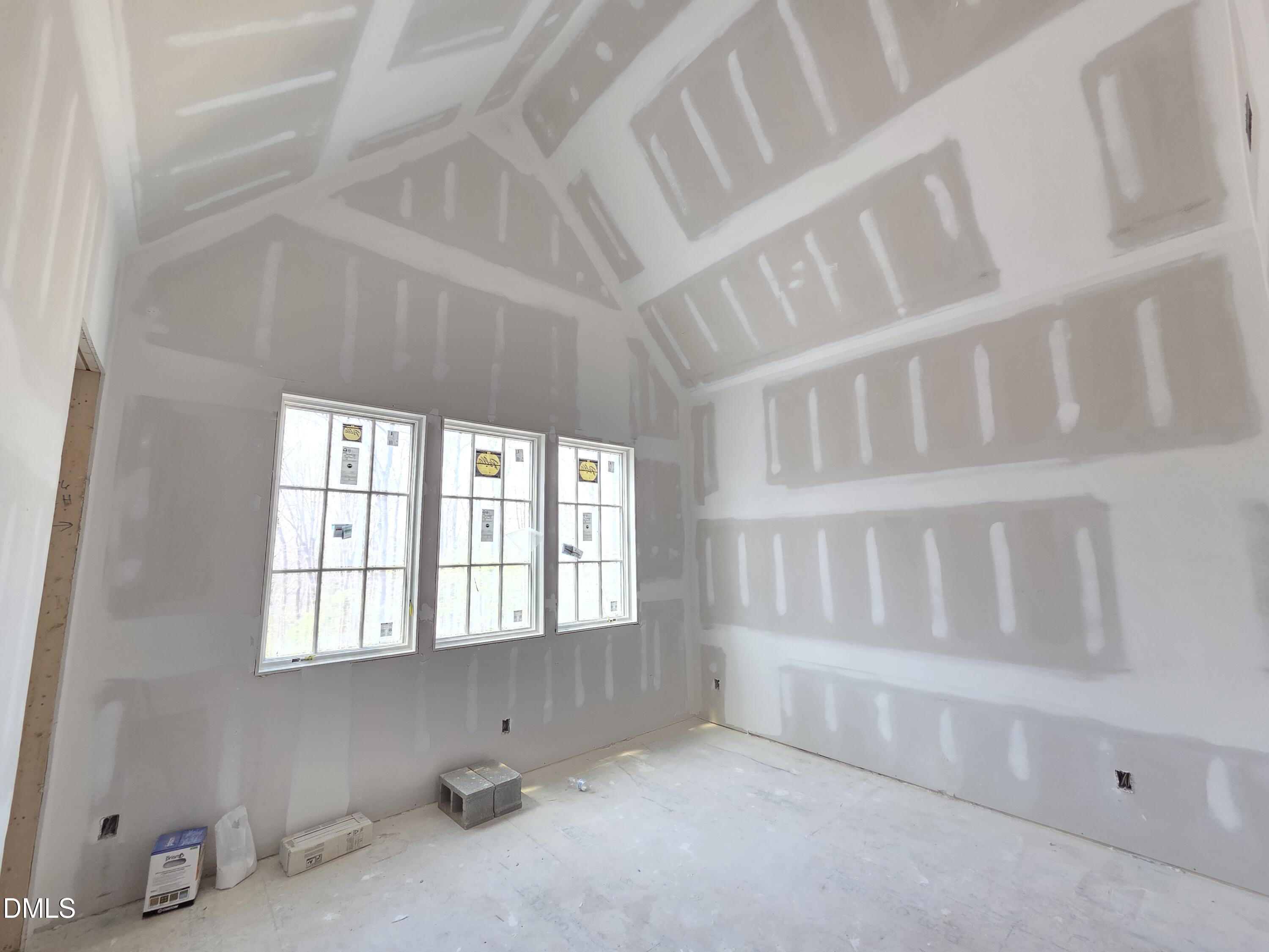 6477 Sanctuary Falls Drive Raleigh, NC 27614 - Photo 41 of 49 a view of an empty room with a window