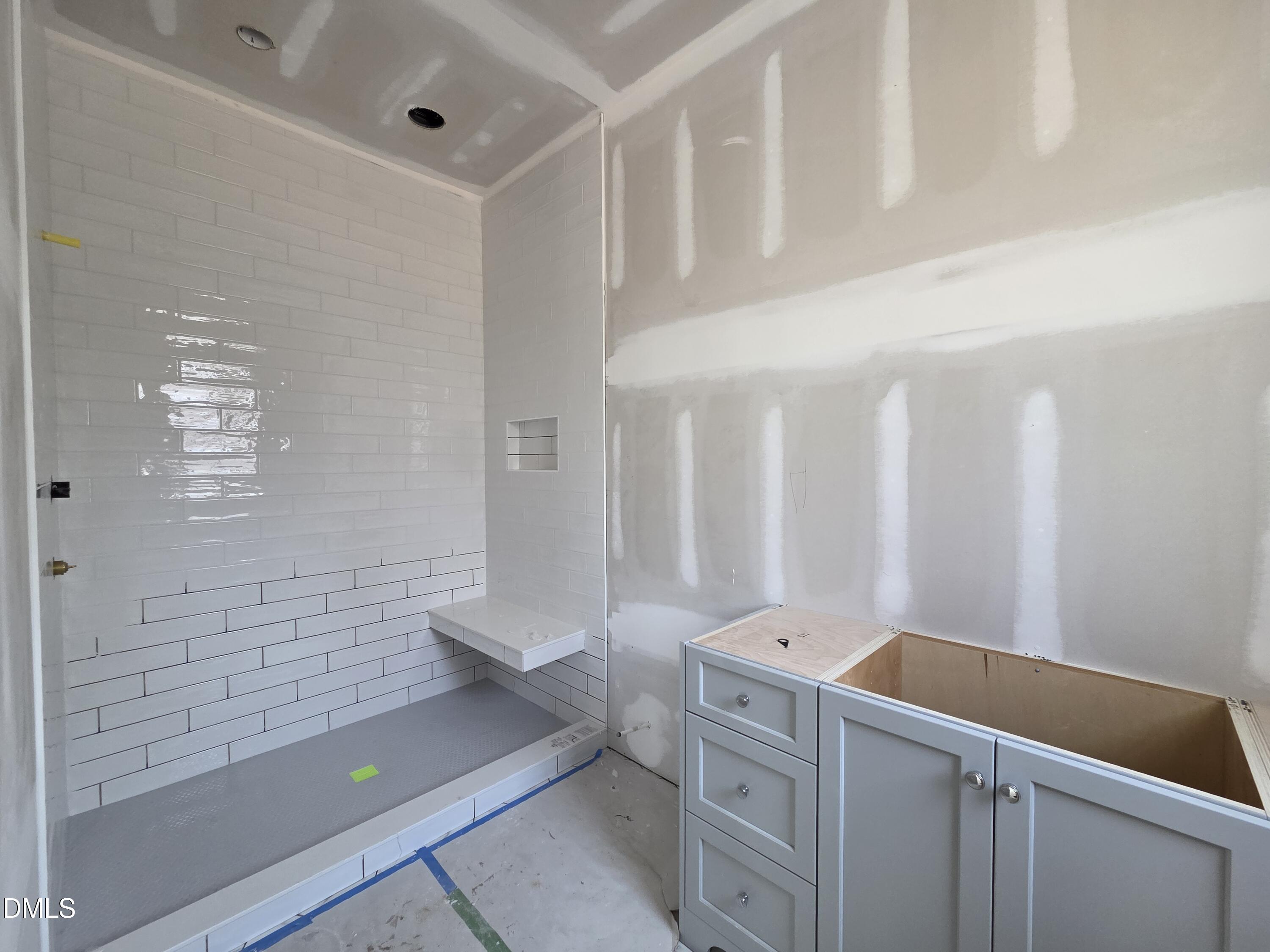 6477 Sanctuary Falls Drive Raleigh, NC 27614 - Photo 42 of 49 a bathroom with a sink a toilet and shower