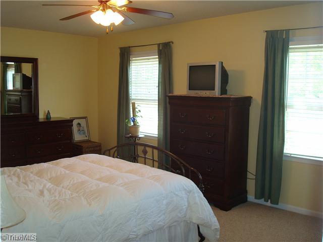 3322 Rockingham Road High Point, NC 27265 - Photo 12 of 13 4th Bedroom. Living Room is currently used as another bedroom (no closet). Ceiling fan.