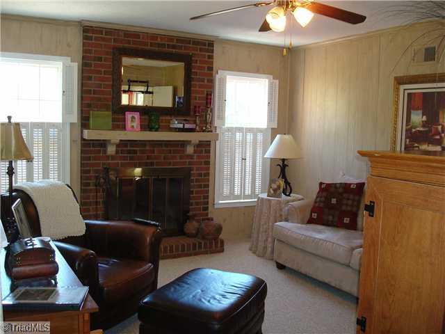 3322 Rockingham Road High Point, NC 27265 - Photo 6 of 13 Den/Family/Great Room. Den centers around a real masonry wood-burning fireplace with raised hearth & mantle. Ceiling fan. Den could also be used as a formal dining room.