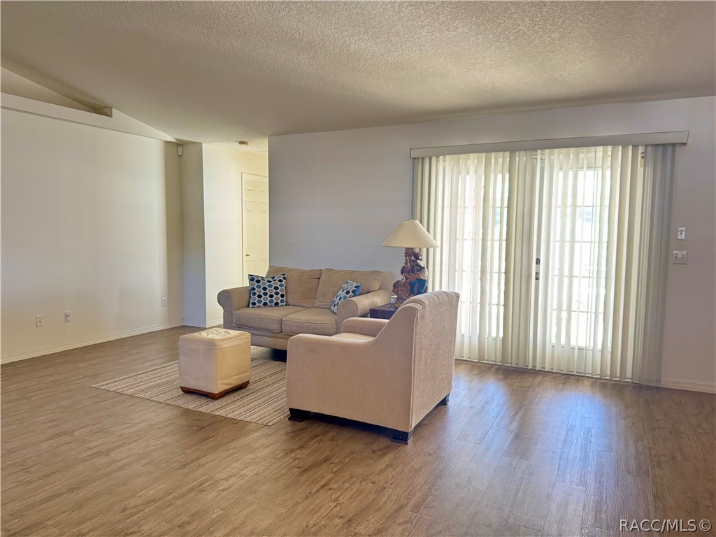 4588 East Van Ness Road Inverness, FL 34453 - Photo 13 of 34 a living room with furniture and wooden floor