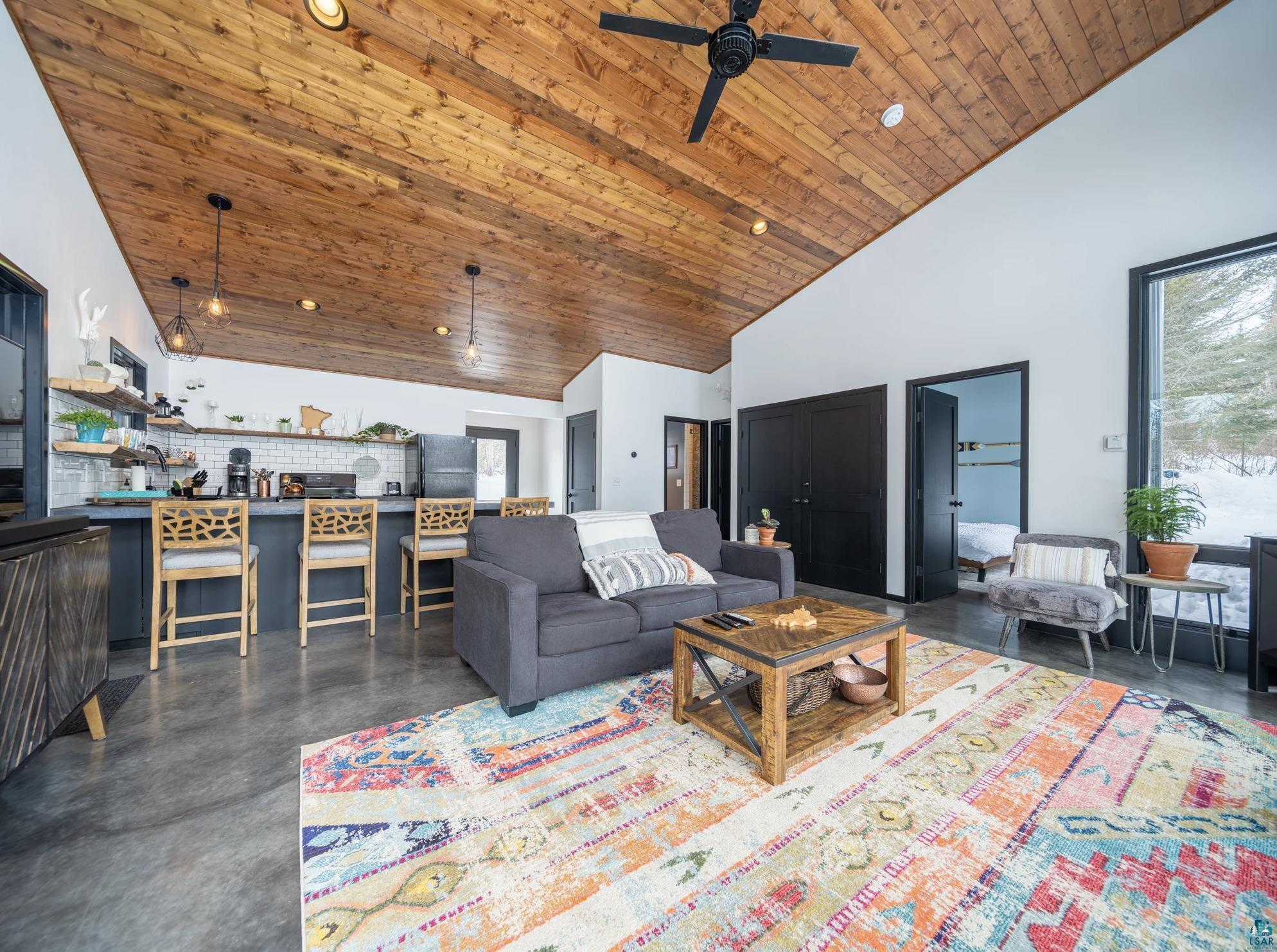 7921 Cramer Road Finland, MN 55603 - Photo 12 of 25 Living room with high vaulted ceiling, wood ceiling, and ceiling fan