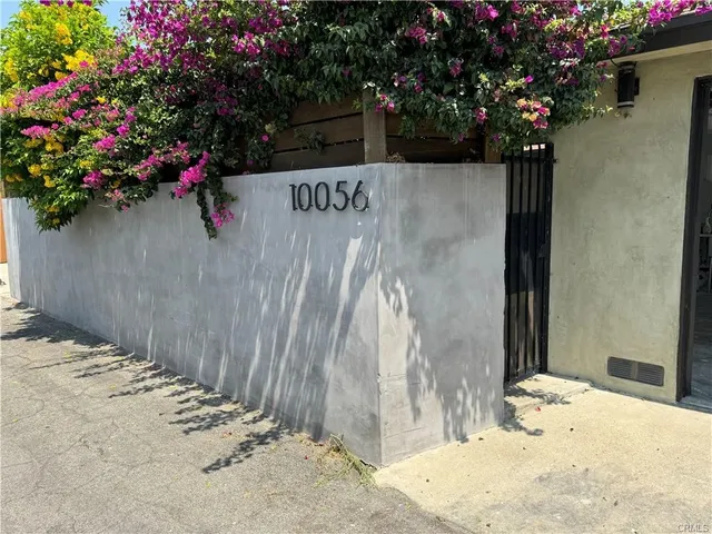 a bathroom with a sink a mirror and a window