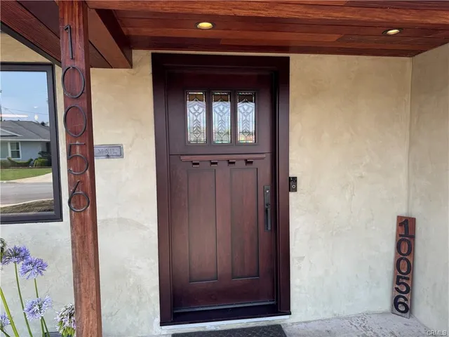 a kitchen with stainless steel appliances granite countertop a sink and a stove