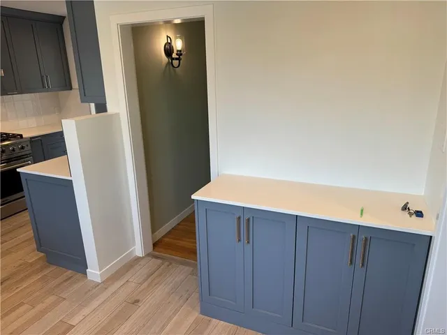 a metallic refrigerator freezer sitting in a kitchen