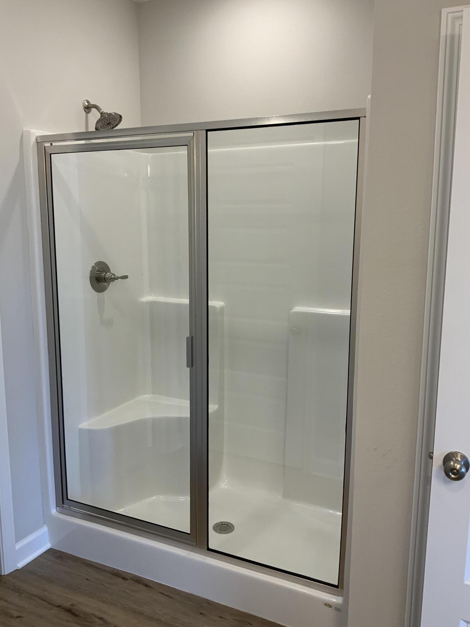 5235 Griffith Mill Road Baker, FL 32531 - Photo 7 of 10 a bathroom with a glass shower door