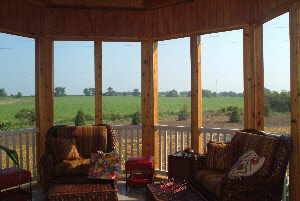12558 Bellingham Road Caledonia, IL 61011 - Photo 6 of 6 a living room with furniture and floor to ceiling windows