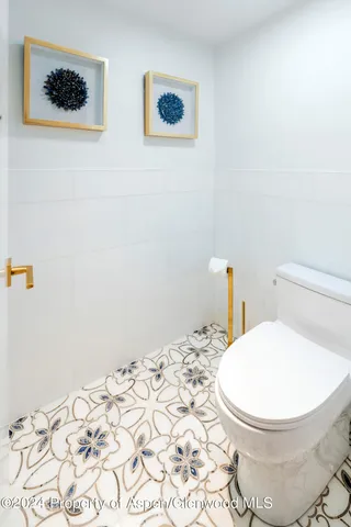 a bathroom with a toilet and a sink