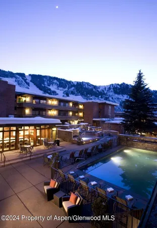 a view of swimming pool with outdoor seating