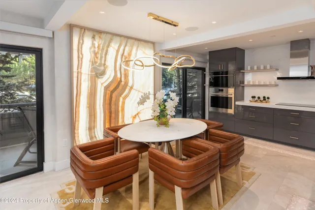 a view of a dining room with furniture and window