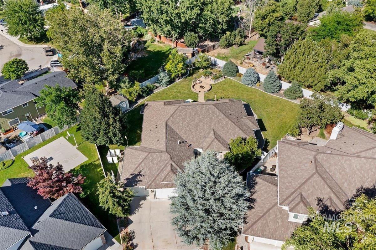 5184 North Greyloch Way Boise, ID 83704 - Photo 29 of 32 Expansive aerial showcasing a residential area with mature tree canopies, diverse home architectural styles, and well-maintained properties