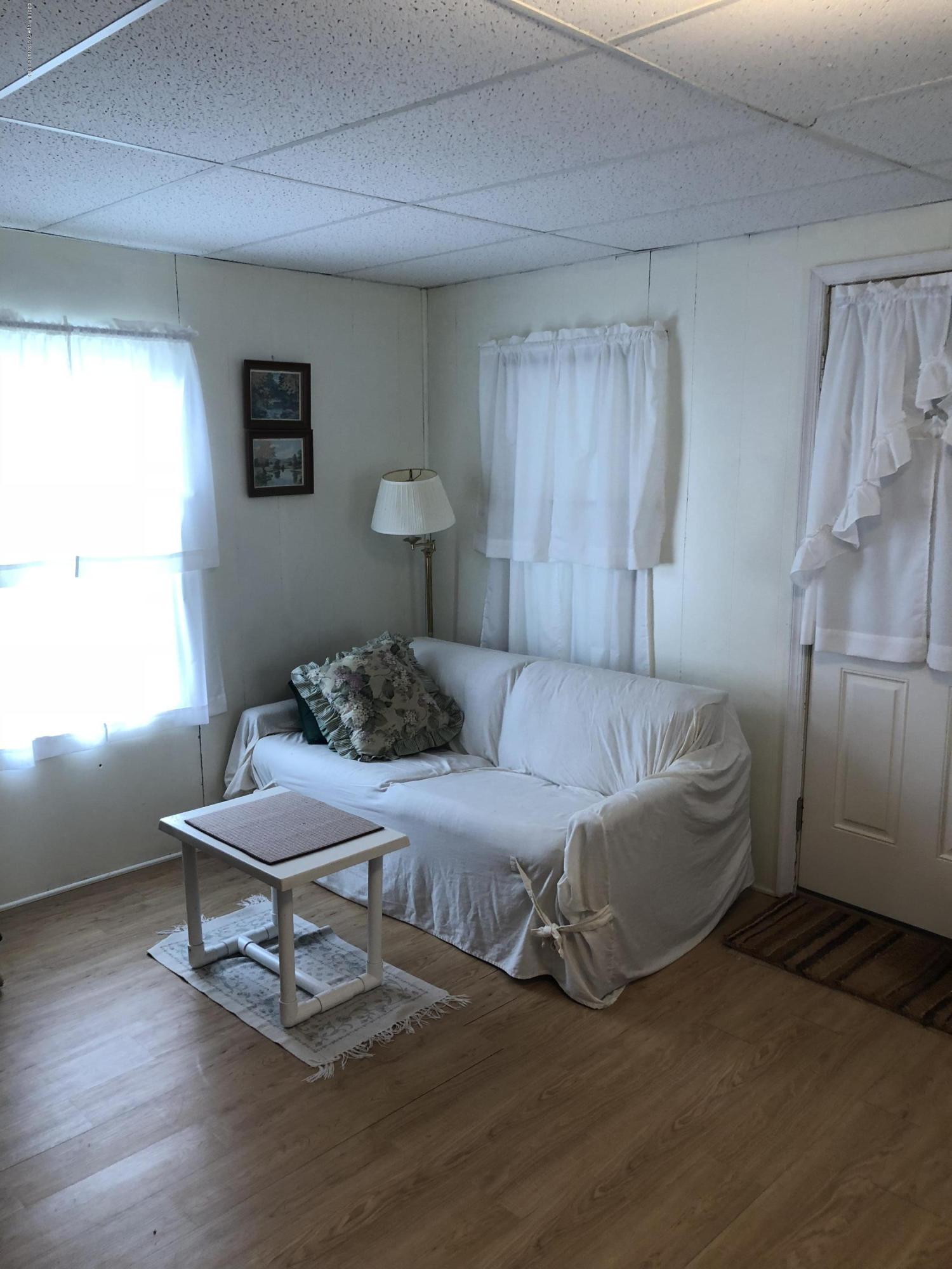 117 Chestnut Street Philadelphia, PA 19106 - Photo 3 of 19 a living room with furniture and a wooden floor