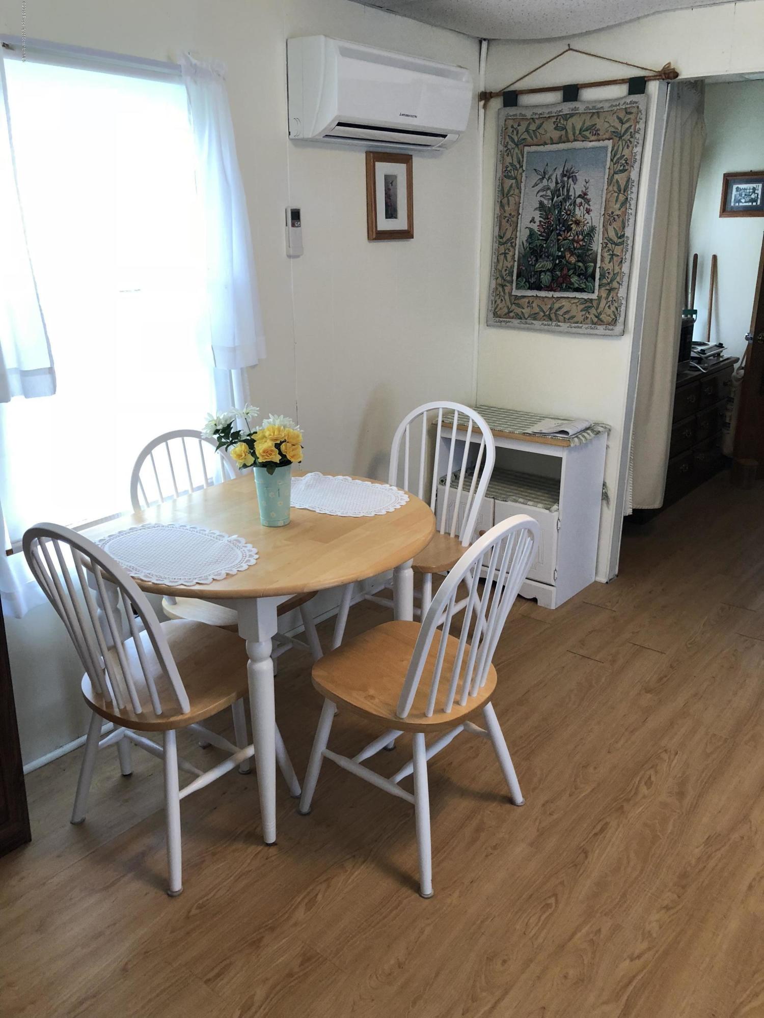 117 Chestnut Street Philadelphia, PA 19106 - Photo 4 of 19 a view of a dining room with furniture window and wooden floor