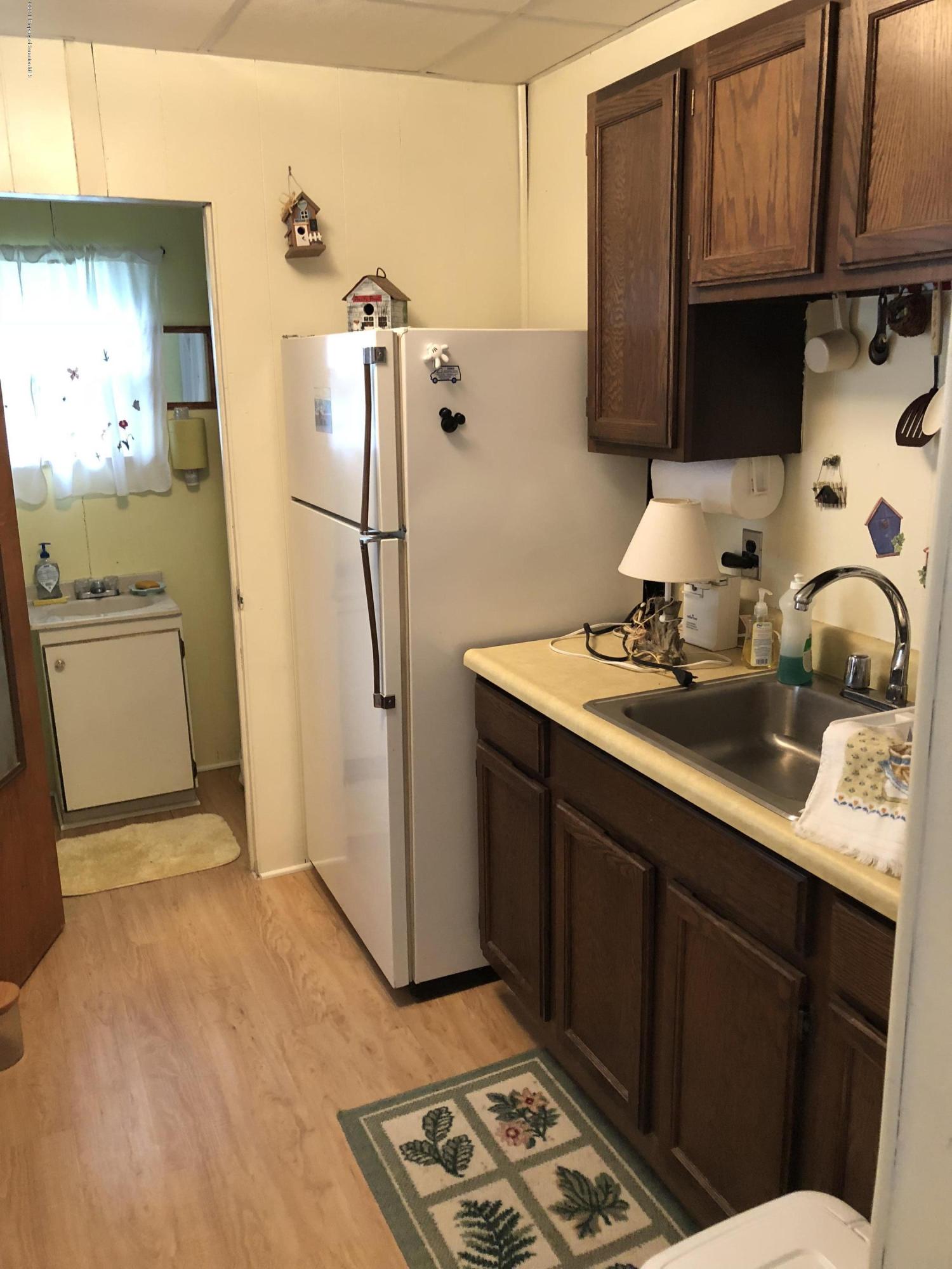 117 Chestnut Street Philadelphia, PA 19106 - Photo 5 of 19 a kitchen with refrigerator and cabinets