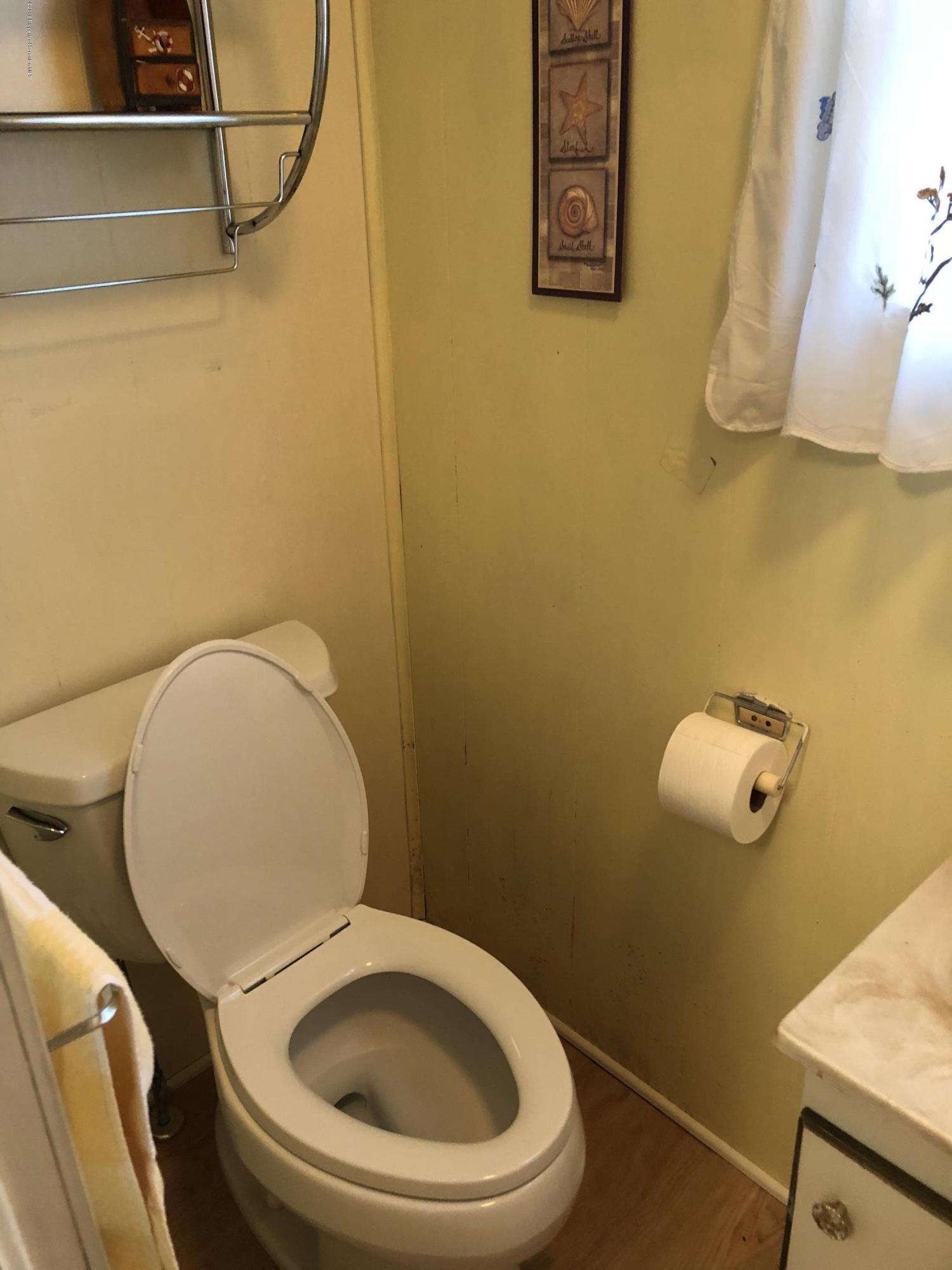 117 Chestnut Street Philadelphia, PA 19106 - Photo 9 of 19 a white toilet sitting next to a bathroom sink