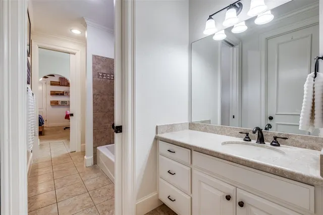 a bathroom with a sink a vanity and a mirror